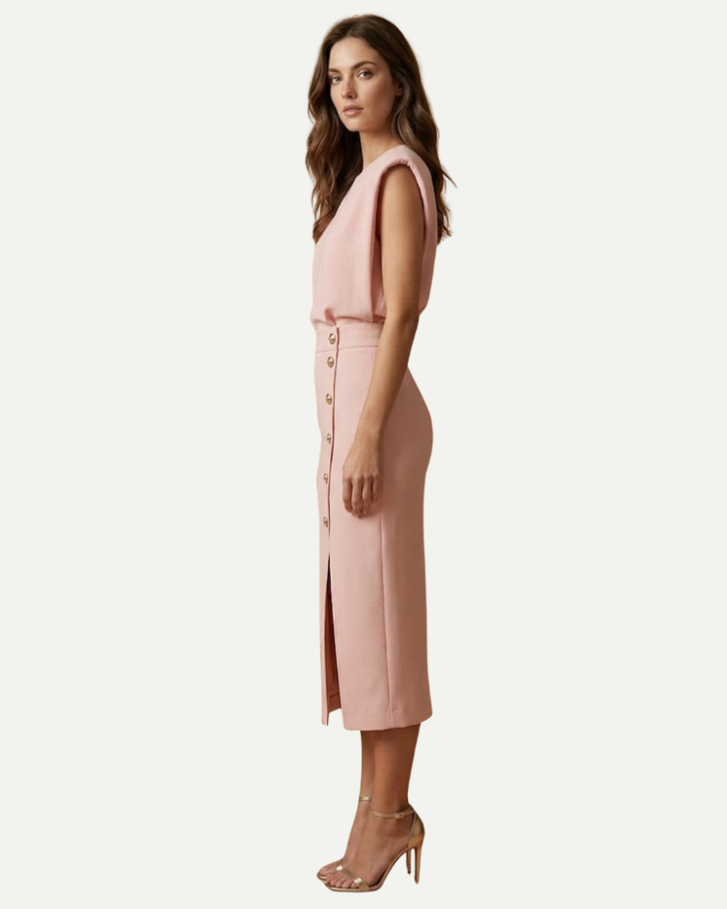 female model wearing blush pink sheath midi dress side profile slit detail Lubomirske