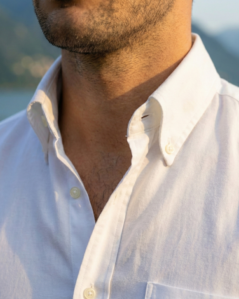 Close-up of men’s white linen button down shirt stand collar