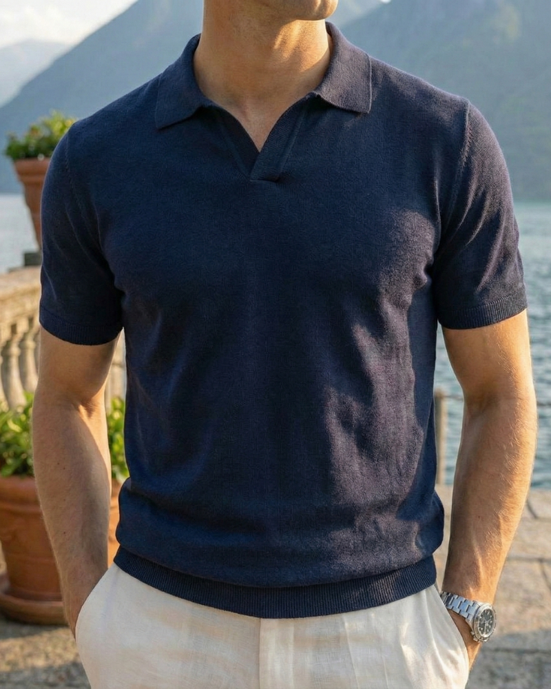 Men’s navy lightweight cotton blend polo shirt styled with casual trousers
