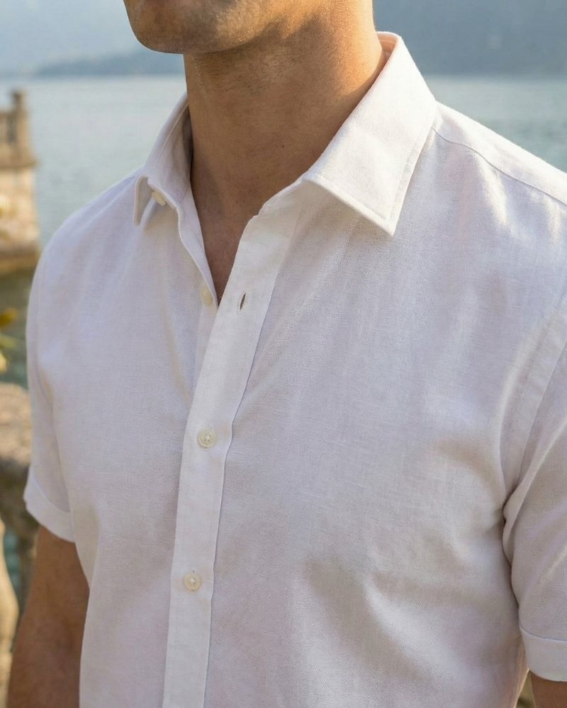 Close-up of men’s white short sleeve button-up dress shirt collar and placket