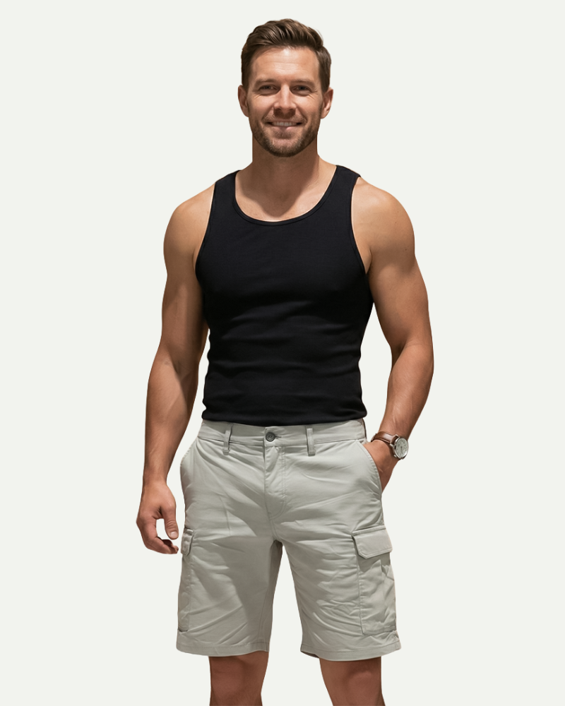 male model wearing light grey cargo shorts standing pose casual fit Lubomirske