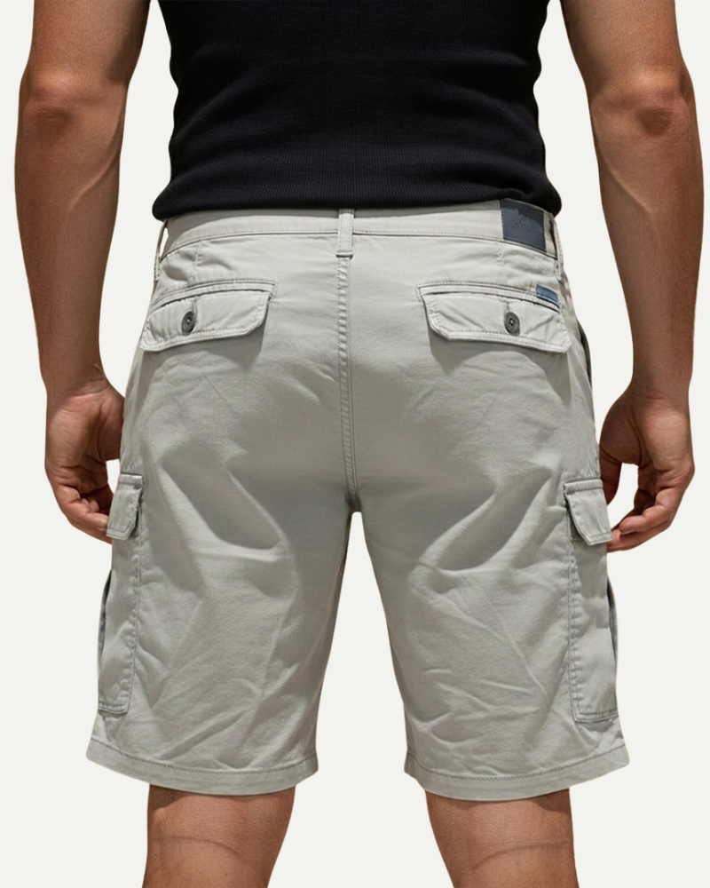 male model wearing light grey cargo shorts back view Lubomirske