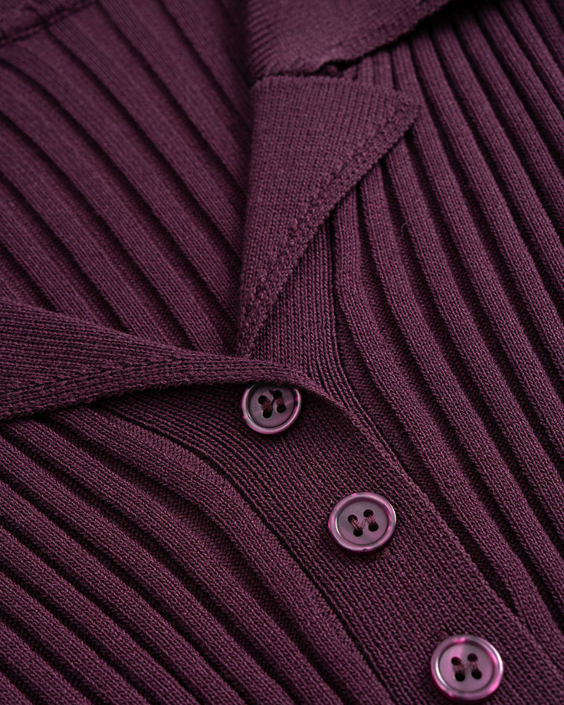 Close-up of burgundy ribbed polo dress button placket detail