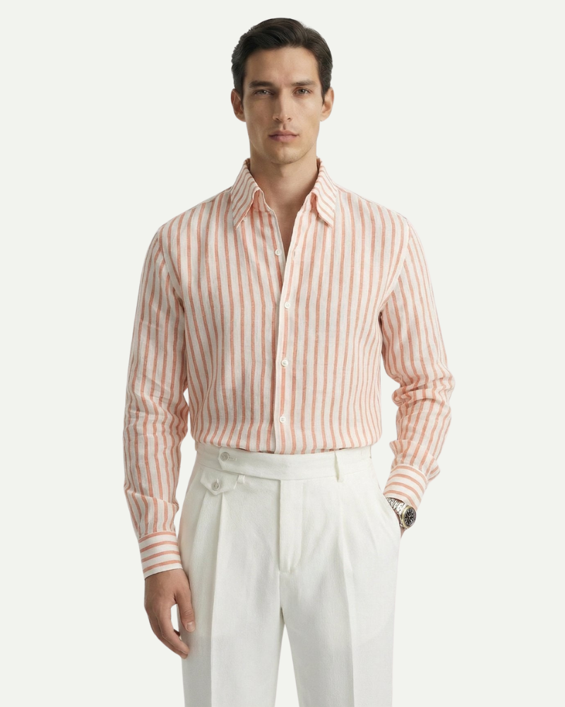 Male model wearing an orange striped linen button-up shirt, front view