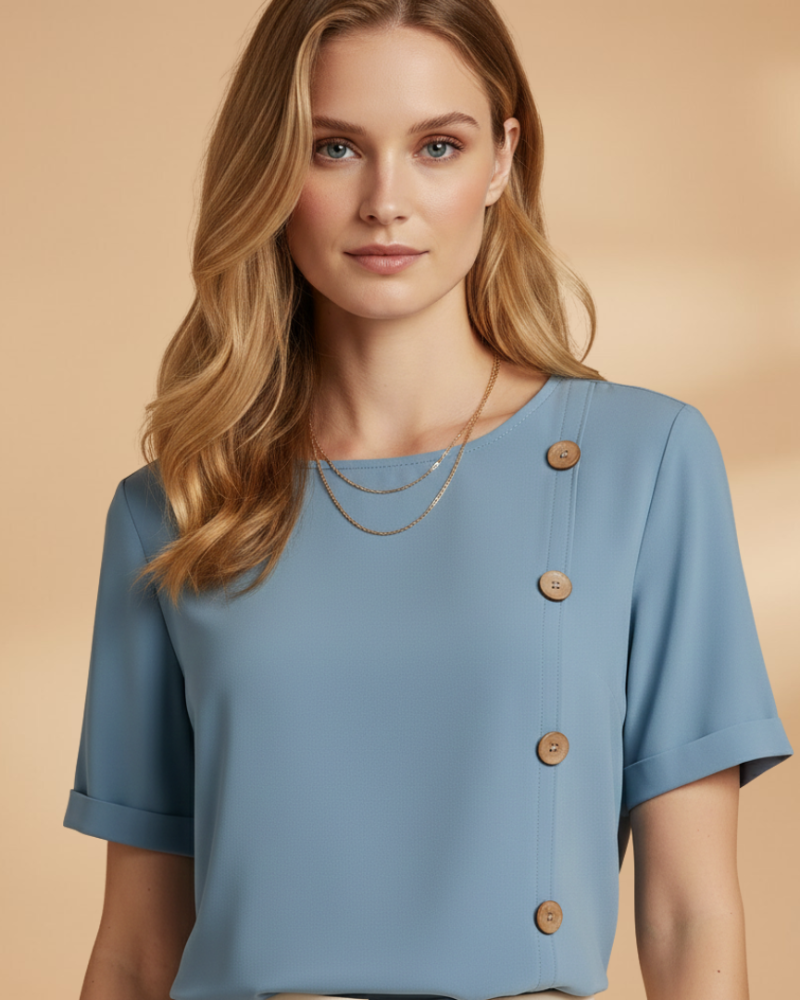 female model wearing light blue blouse close up button detail Lubomirske