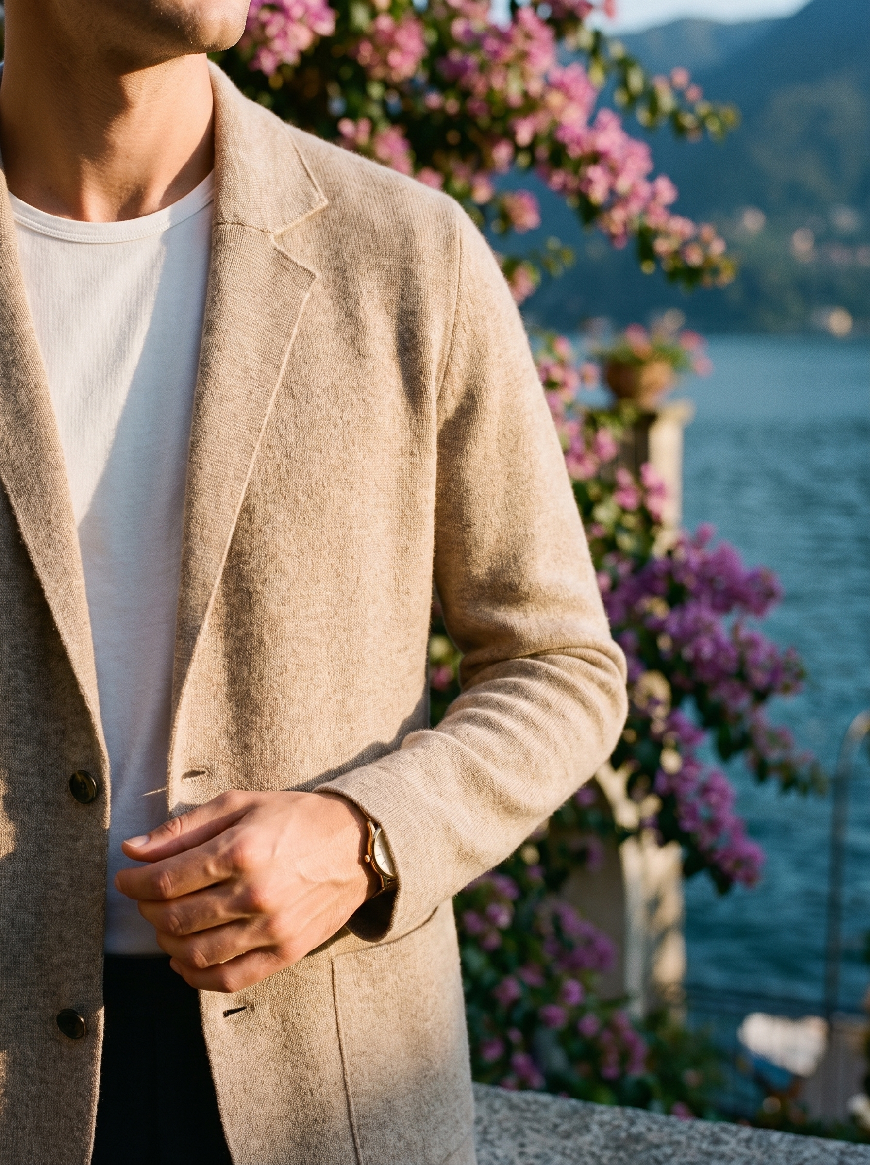 Knitted notch lapel and patch pocket detail of a beige wool blazer cardigan — Aveloire