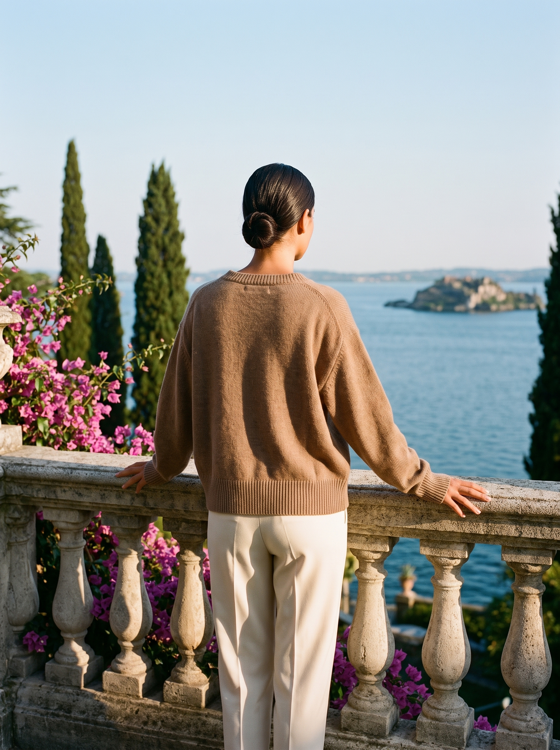 Brown knit cardigan, full body back view on a Lake Como terrace — Aveloire
