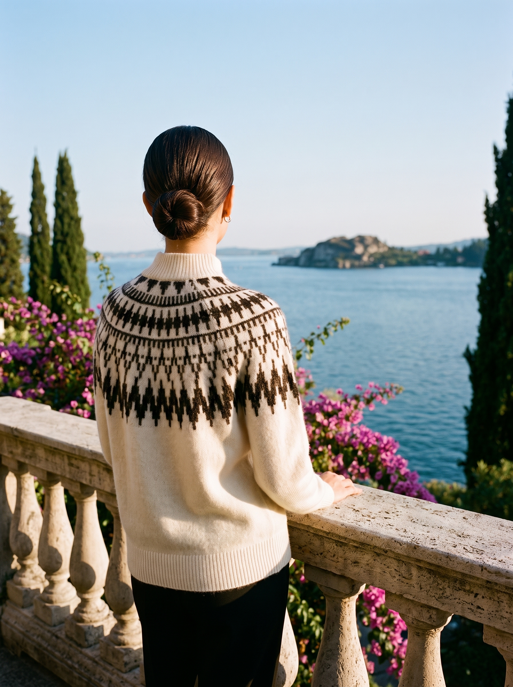 Back view of a cream Fair Isle mock-neck jumper on a Lake Como terrace — Aveloire