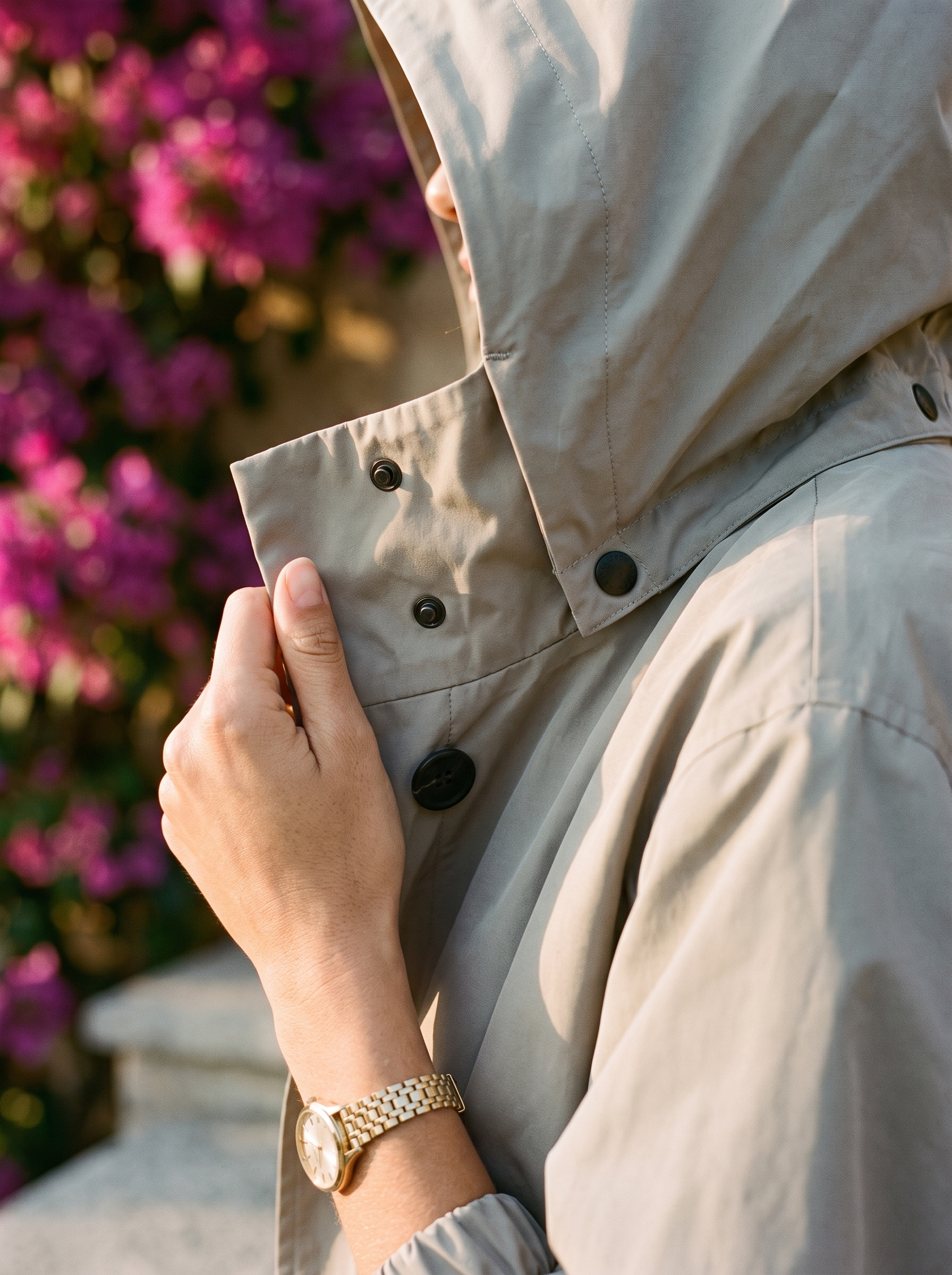 Grey raincoat funnel collar and snap button detail