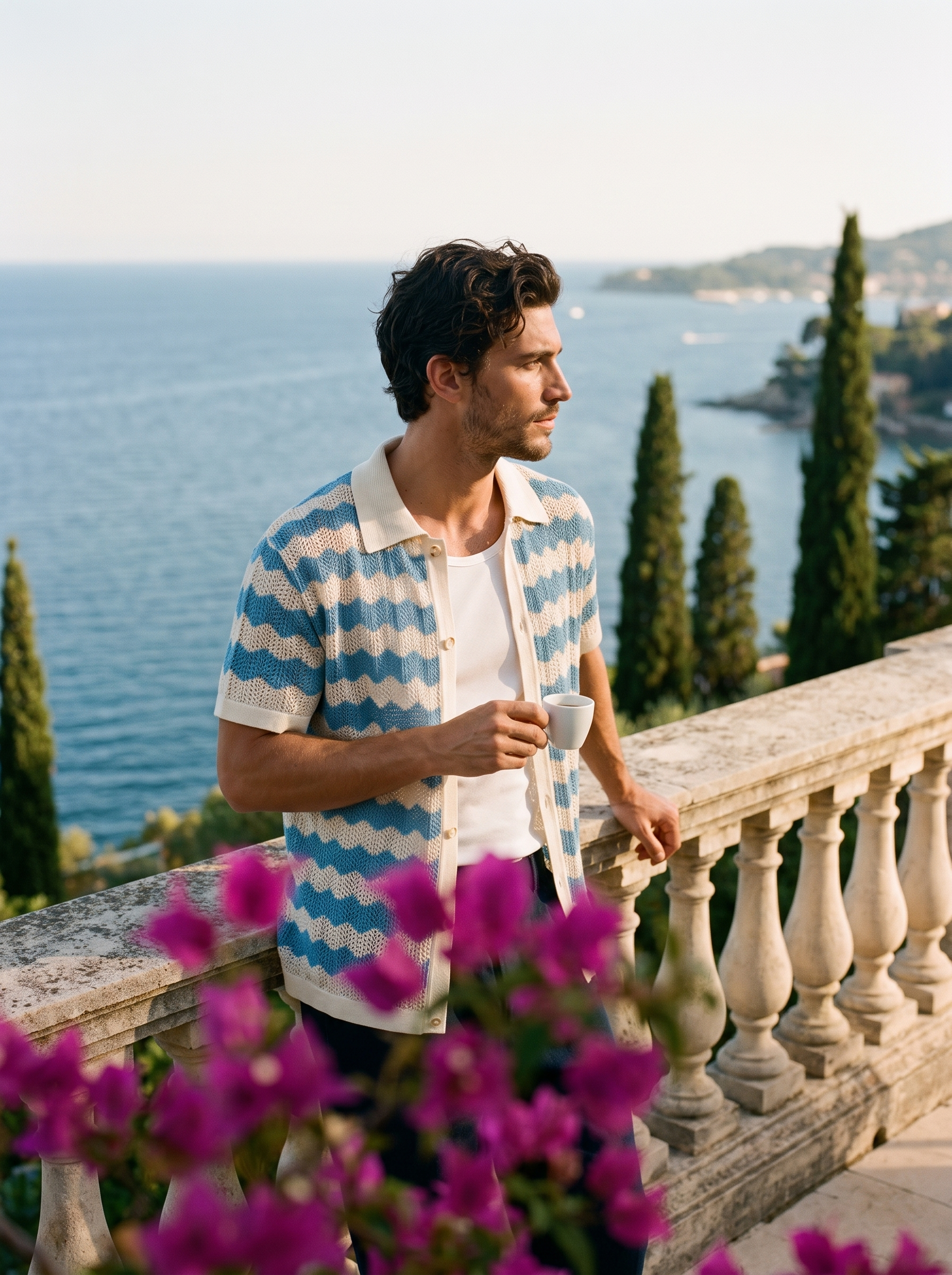 Man in a blue and cream wave knit button shirt with an espresso on a Lake Como terrace, old money lifestyle — Aveloire