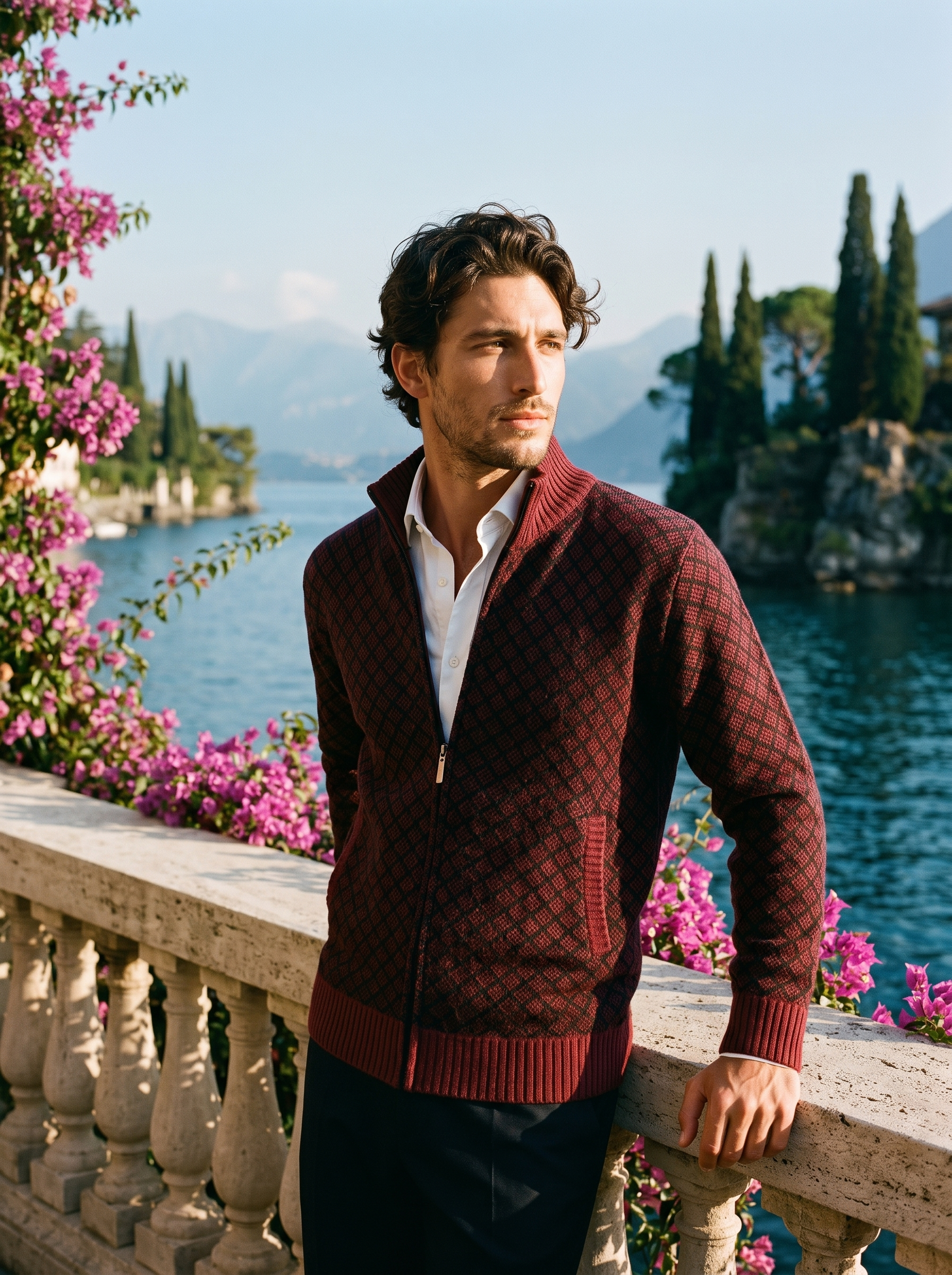 Man wearing a burgundy full-zip stand collar cardigan on a terrace overlooking Lake Como, old money style — Aveloire
