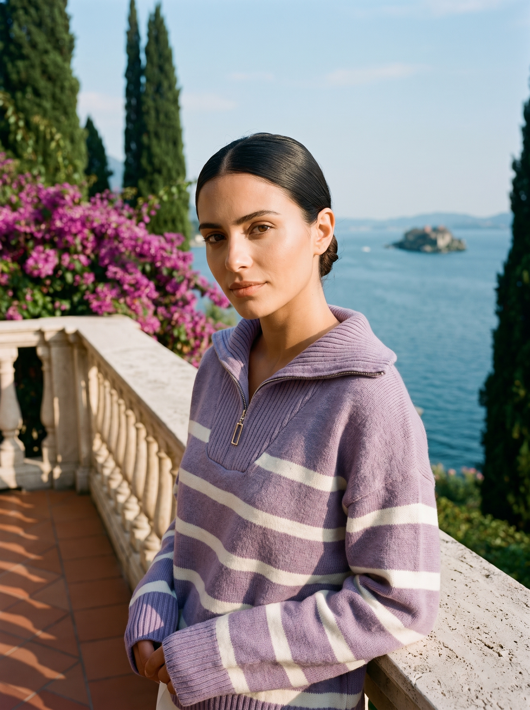 Woman wearing a lavender and cream striped quarter-zip polo sweater on a Lake Como terrace — Aveloire