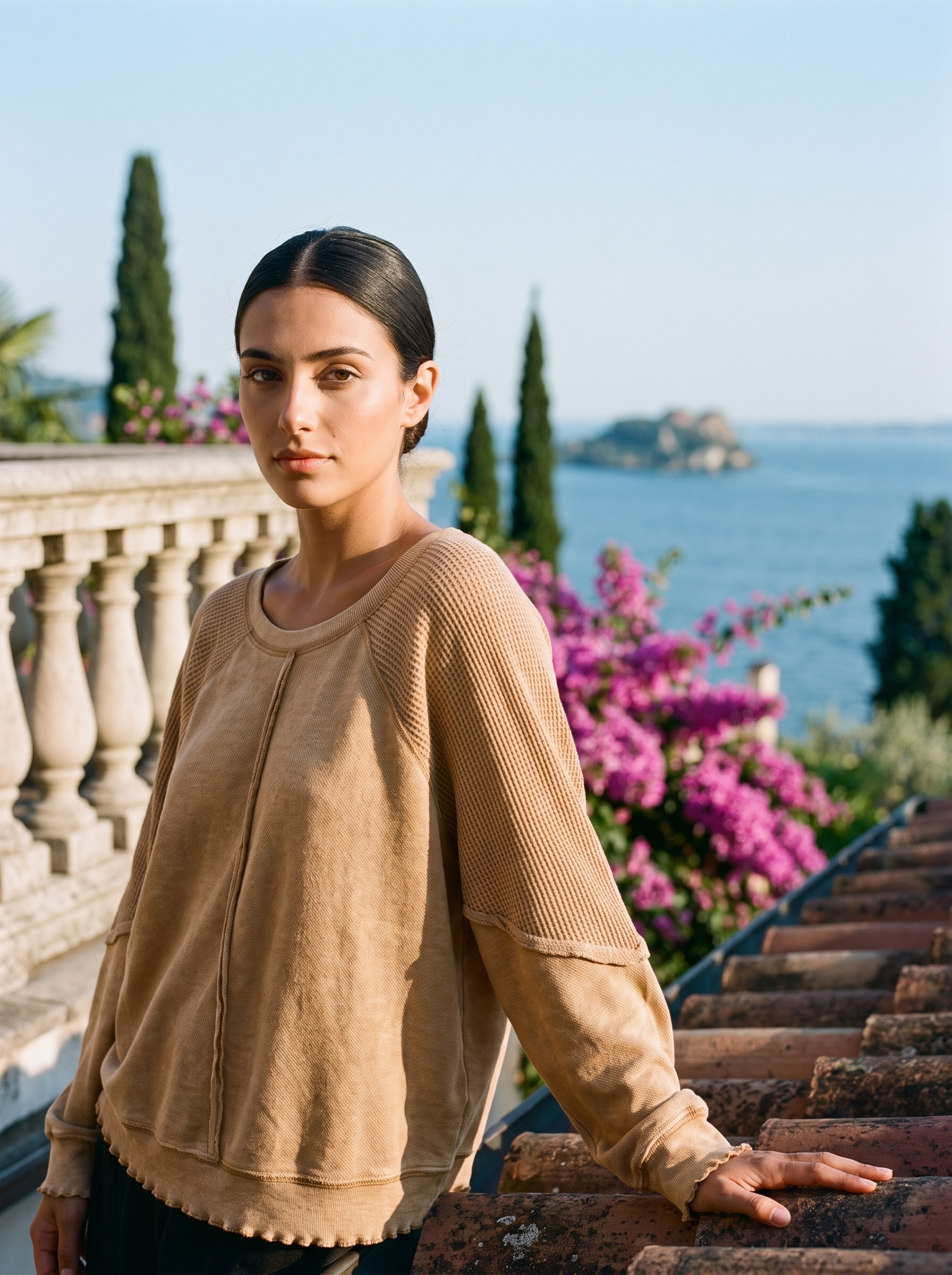 Woman wearing a camel waffle-panel top on a Lake Como terrace, old money style — Aveloire