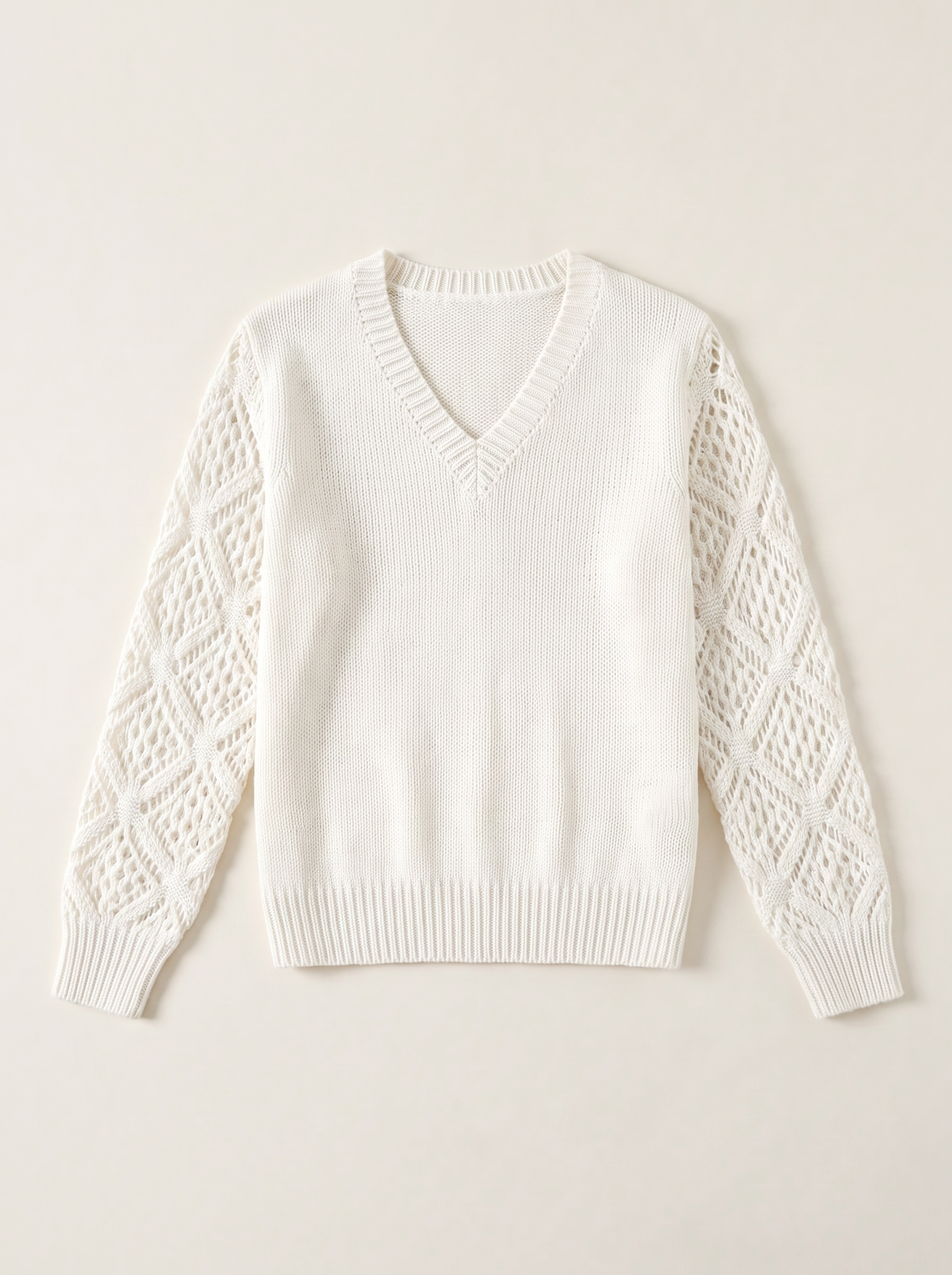 Ivory V-neck knit jumper flat lay — Aveloire