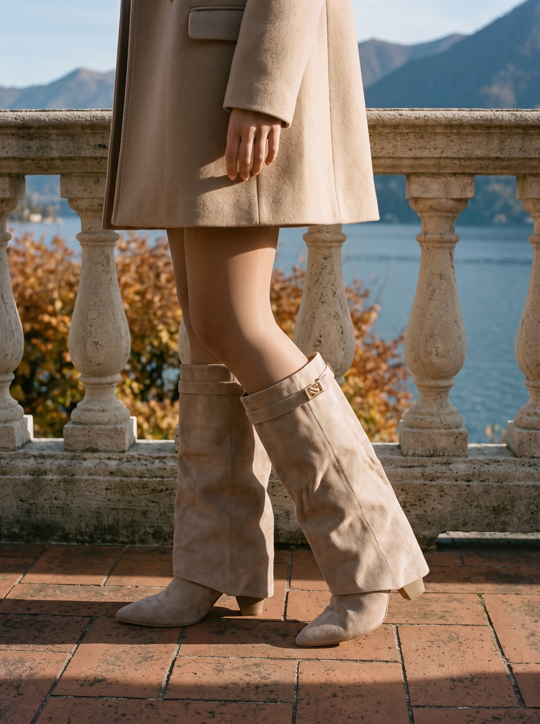 Taupe suede knee high boots for women, fold over wedge worn on a Lake Como terrace — Aveloire