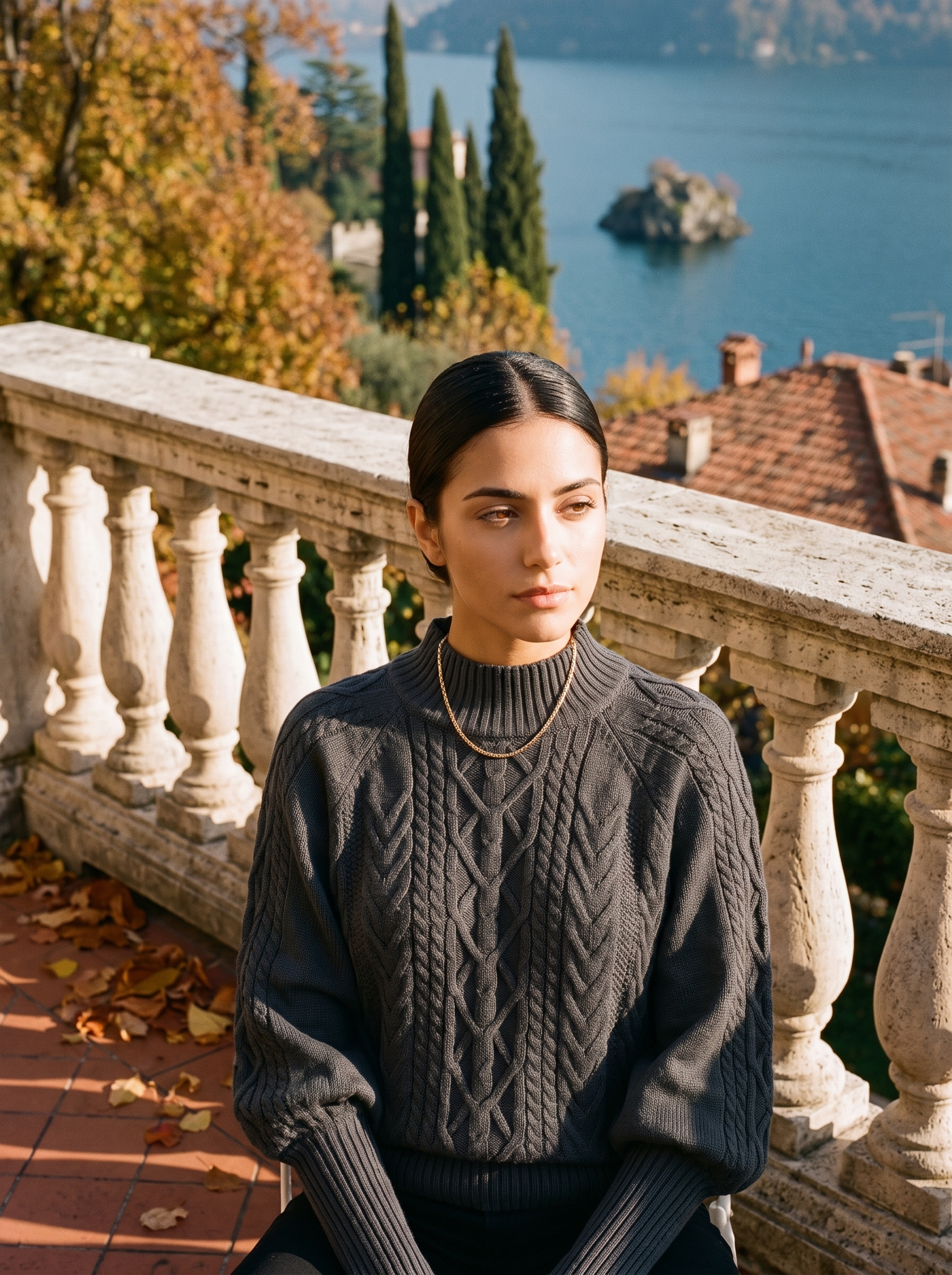 Woman wearing a dark gray cable knit mock neck sweater by Lake Como — Aveloire
