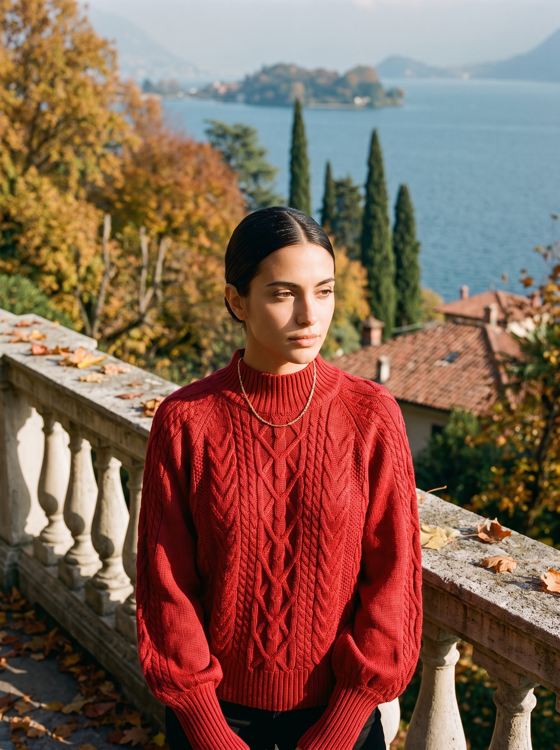 Woman wearing a red cable knit mock neck sweater by Lake Como — Aveloire
