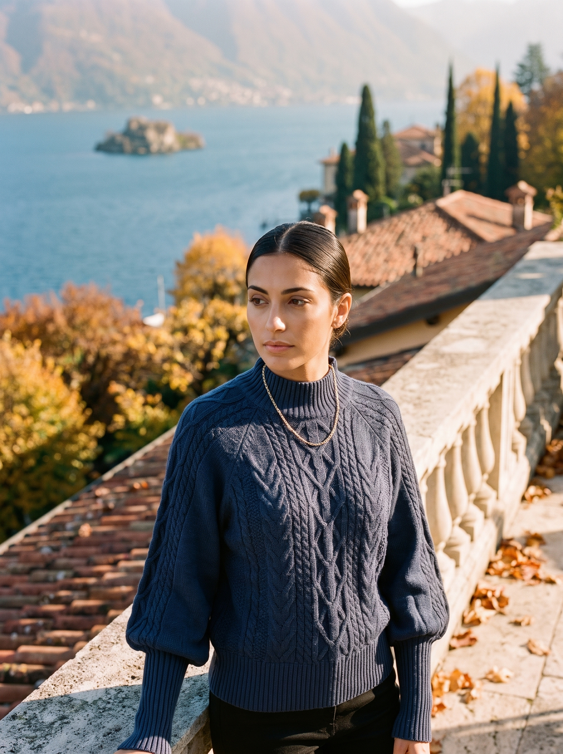Woman wearing a navy cable knit mock neck sweater by Lake Como — Aveloire