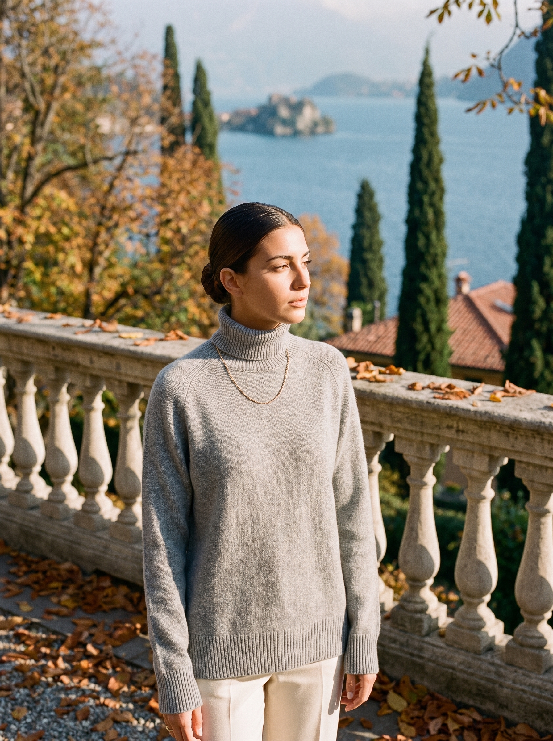 Woman wearing a light gray women's turtleneck sweater by Lake Como - Aveloire