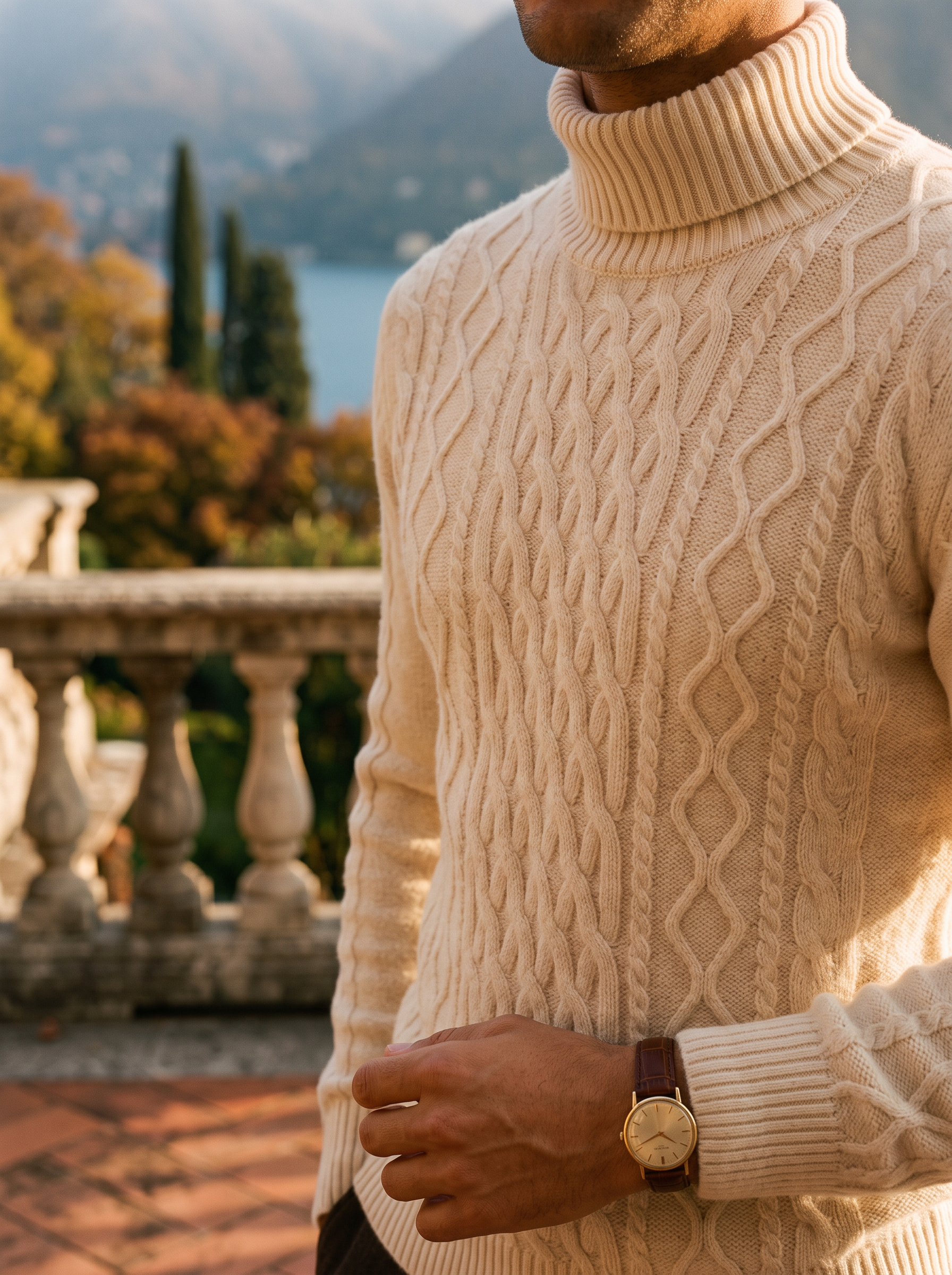 Close-up of the cable knit texture on a cream wool turtleneck sweater — Aveloire