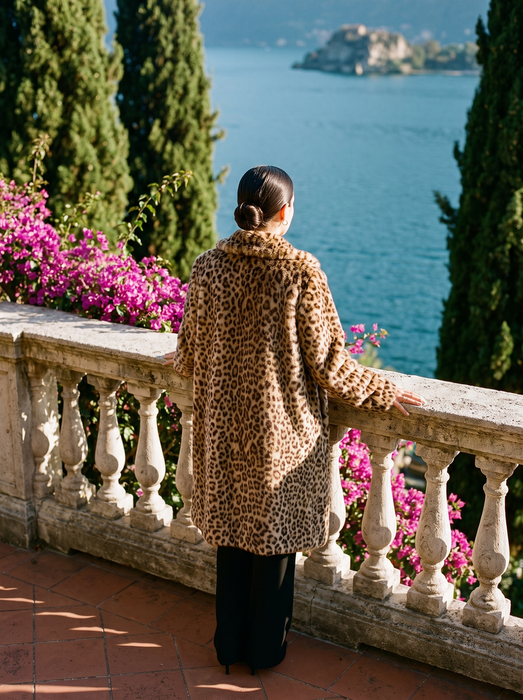 Classic leopard print faux fur coat back view at balustrade