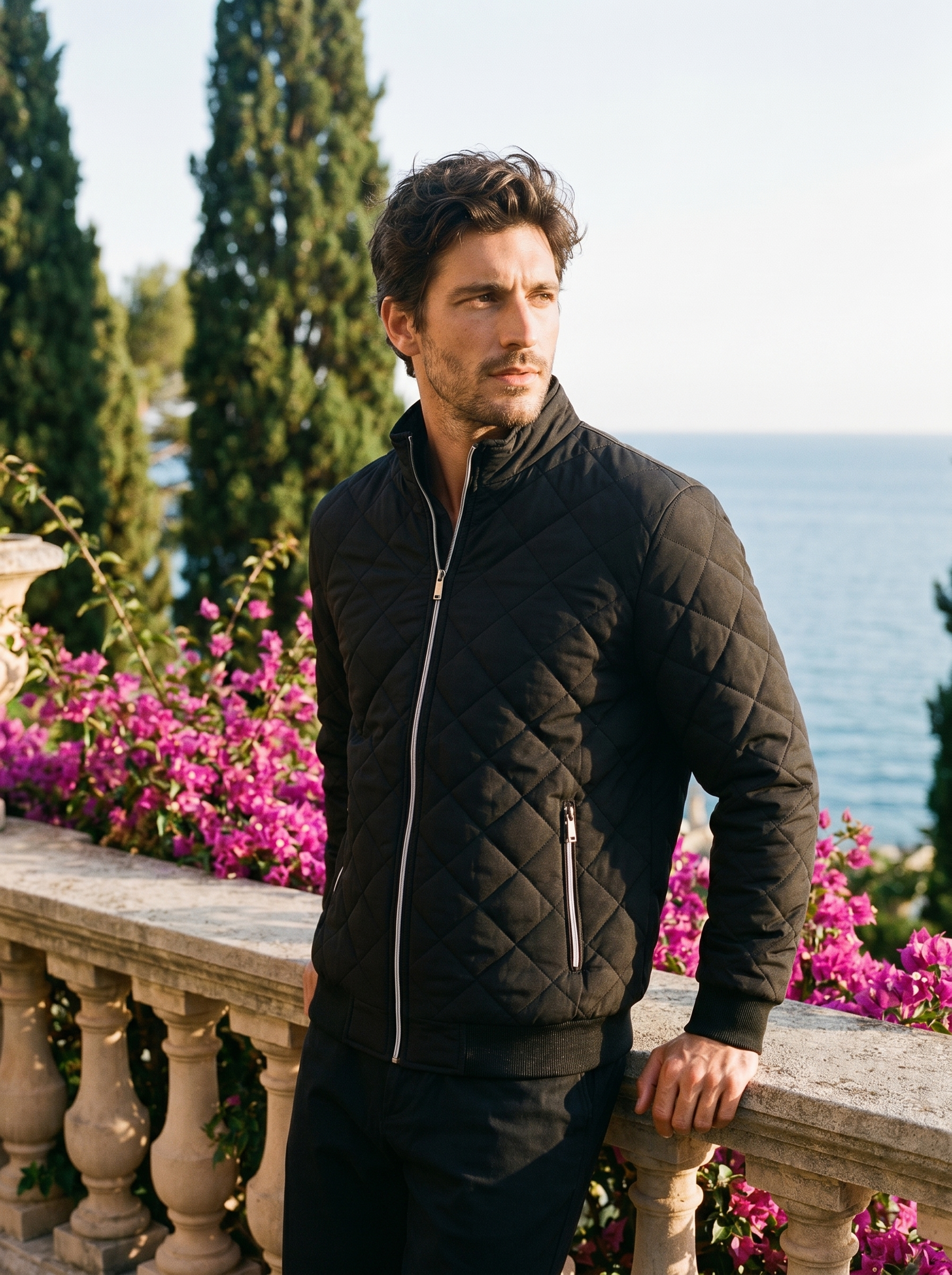 Black fleece lined quilted jacket for men, worn on a Lake Como terrace — Aveloire