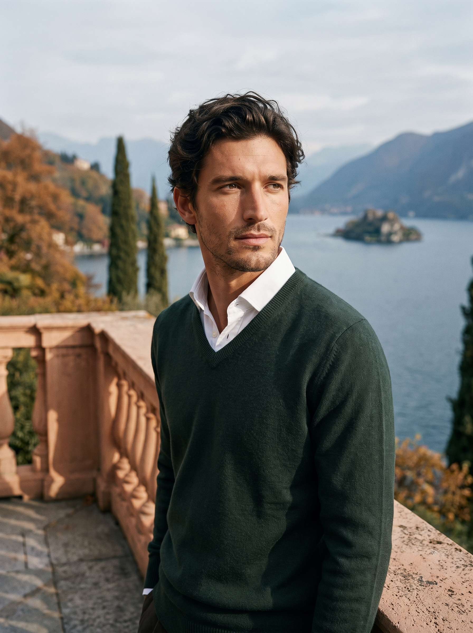 Dark green wool v neck sweater for men, worn on a Lake Como terrace — Aveloire
