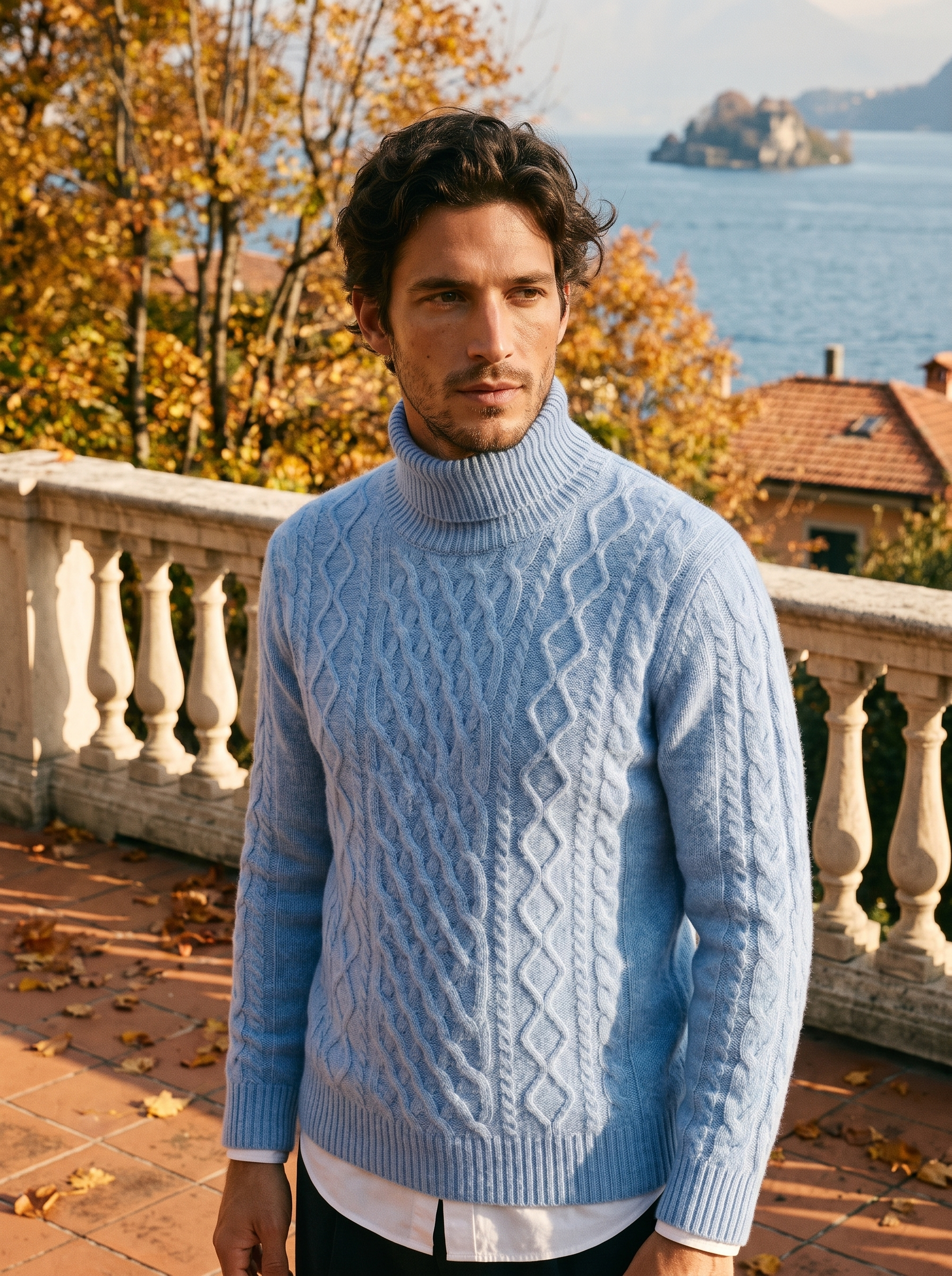 Man wearing a light blue wool cable knit turtleneck sweater by Lake Como — Aveloire