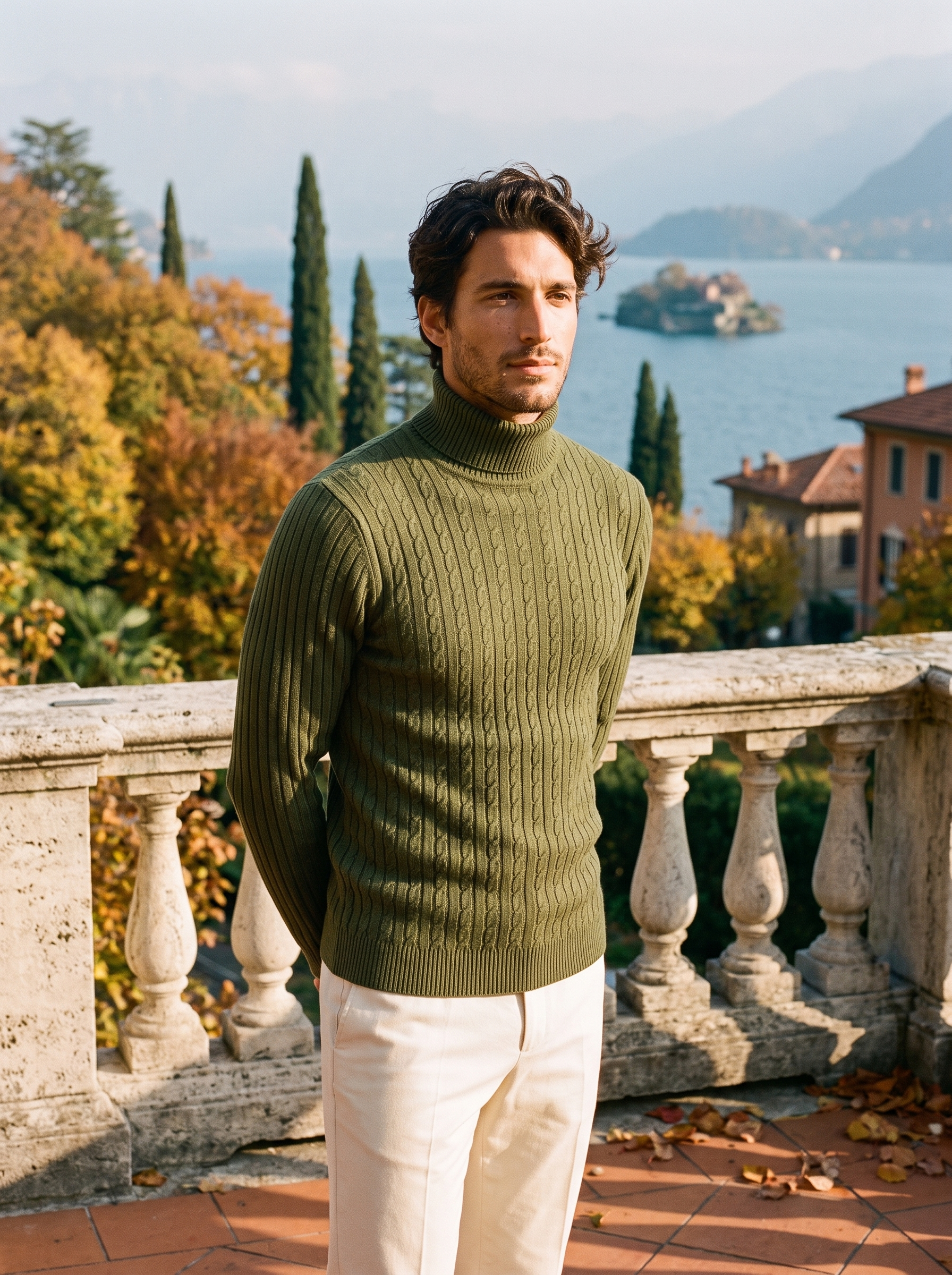 Man wearing an army green cable knit turtleneck sweater by the lake — Aveloire