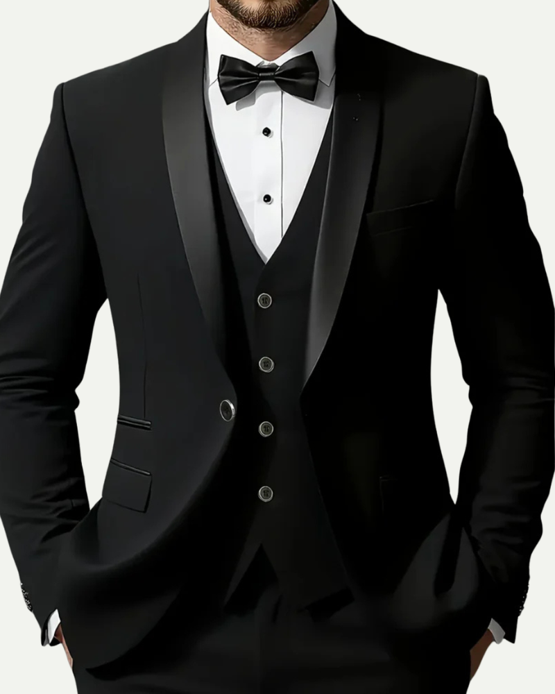 Close up male model wearing black tuxedo suit vest and bow tie formal detail
