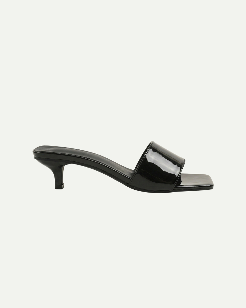 Women’s black slip-on kitten heel sandals with open toe and minimalist design by Aveloire