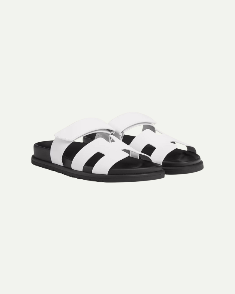 White and black velcro strap slide sandals pair view