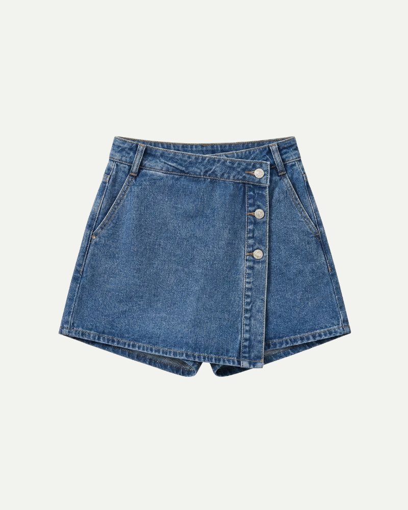 Blue denim skort with button details on a light gray background
