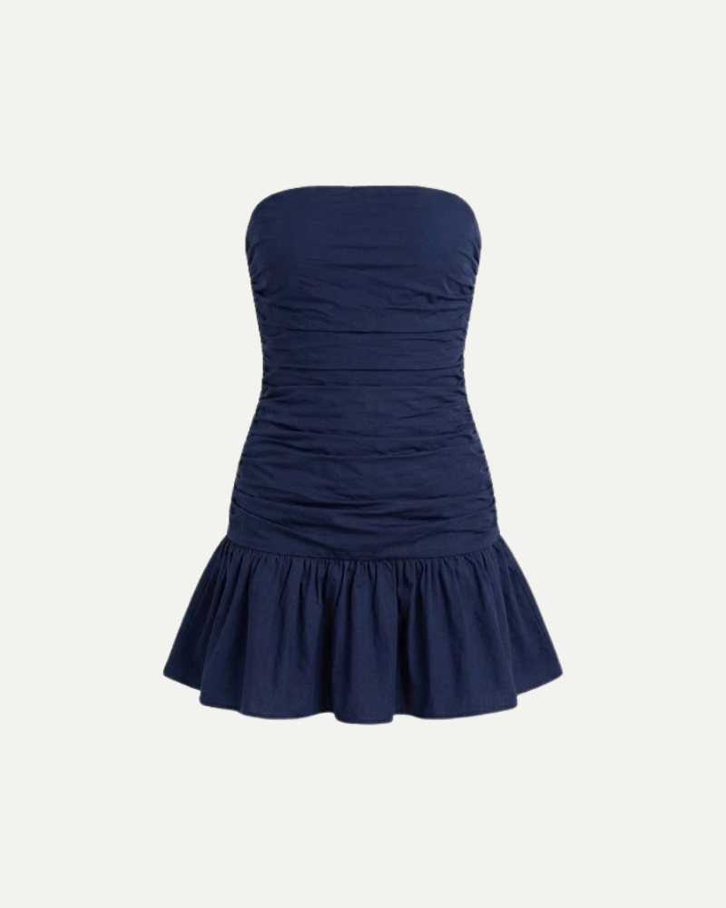 Women’s navy blue strapless mini dress with ruched bodice and ruffled A-line hem by Aveloire