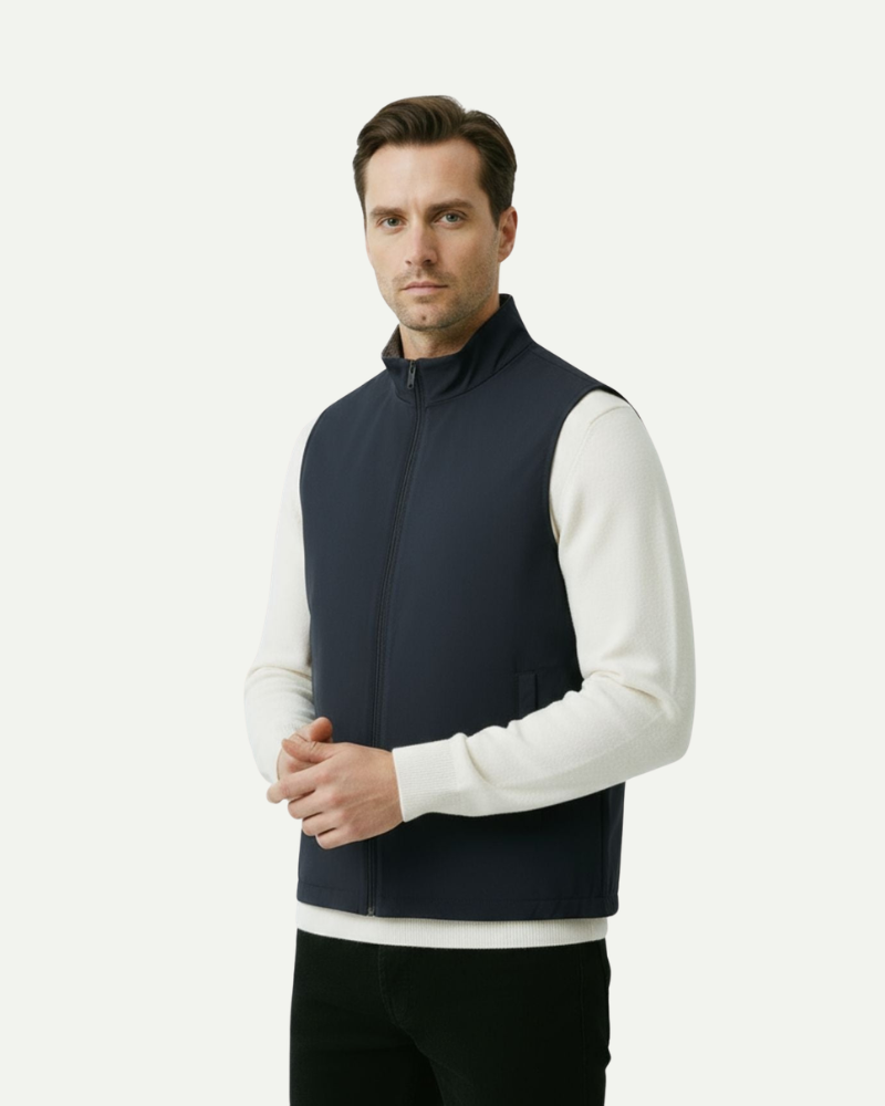 Male model wearing a navy blue reversible zip-up vest with a slim fit

