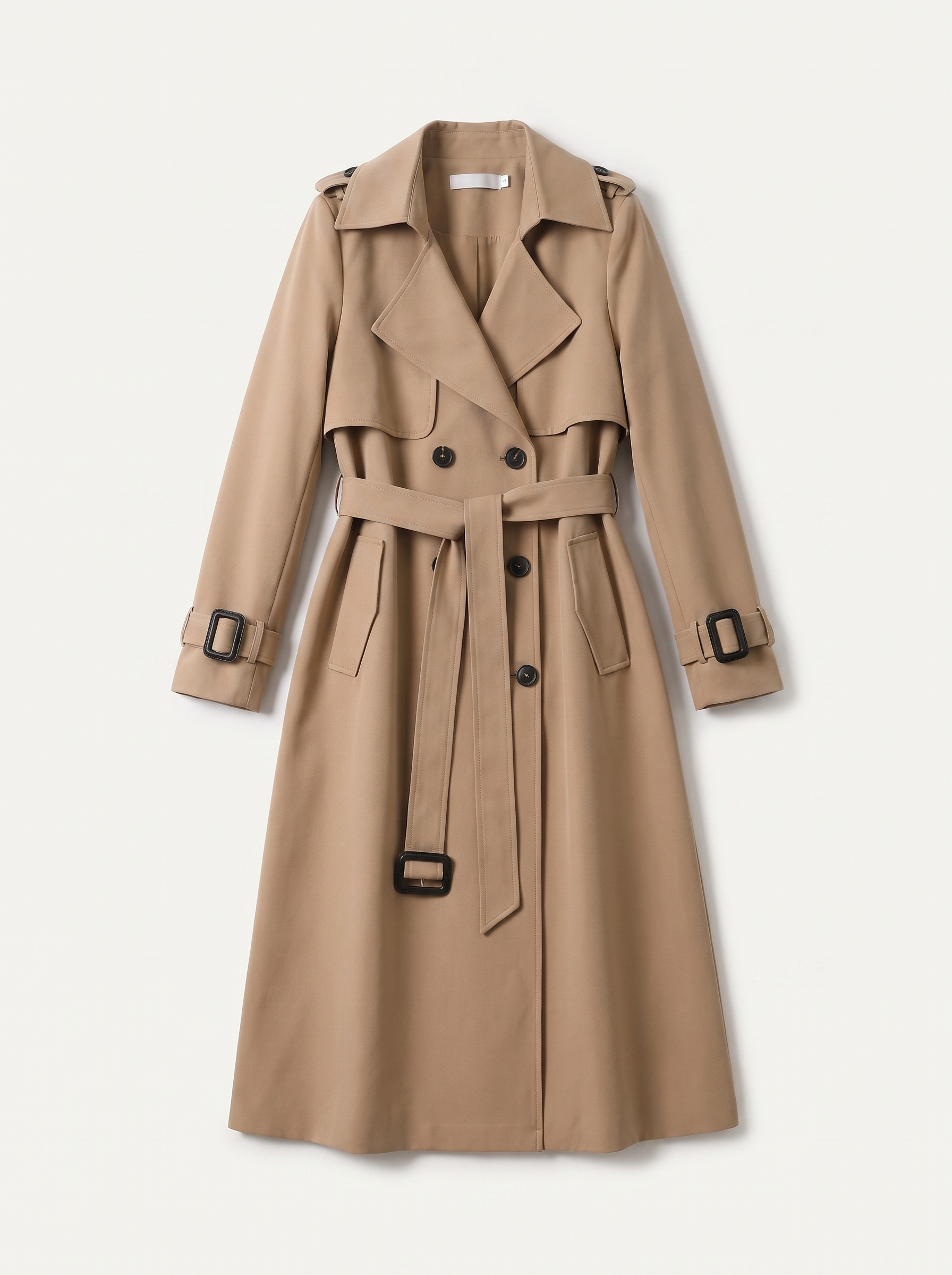 Beige double-breasted belted trench coat flat lay product photo — Geneviève by Aveloire