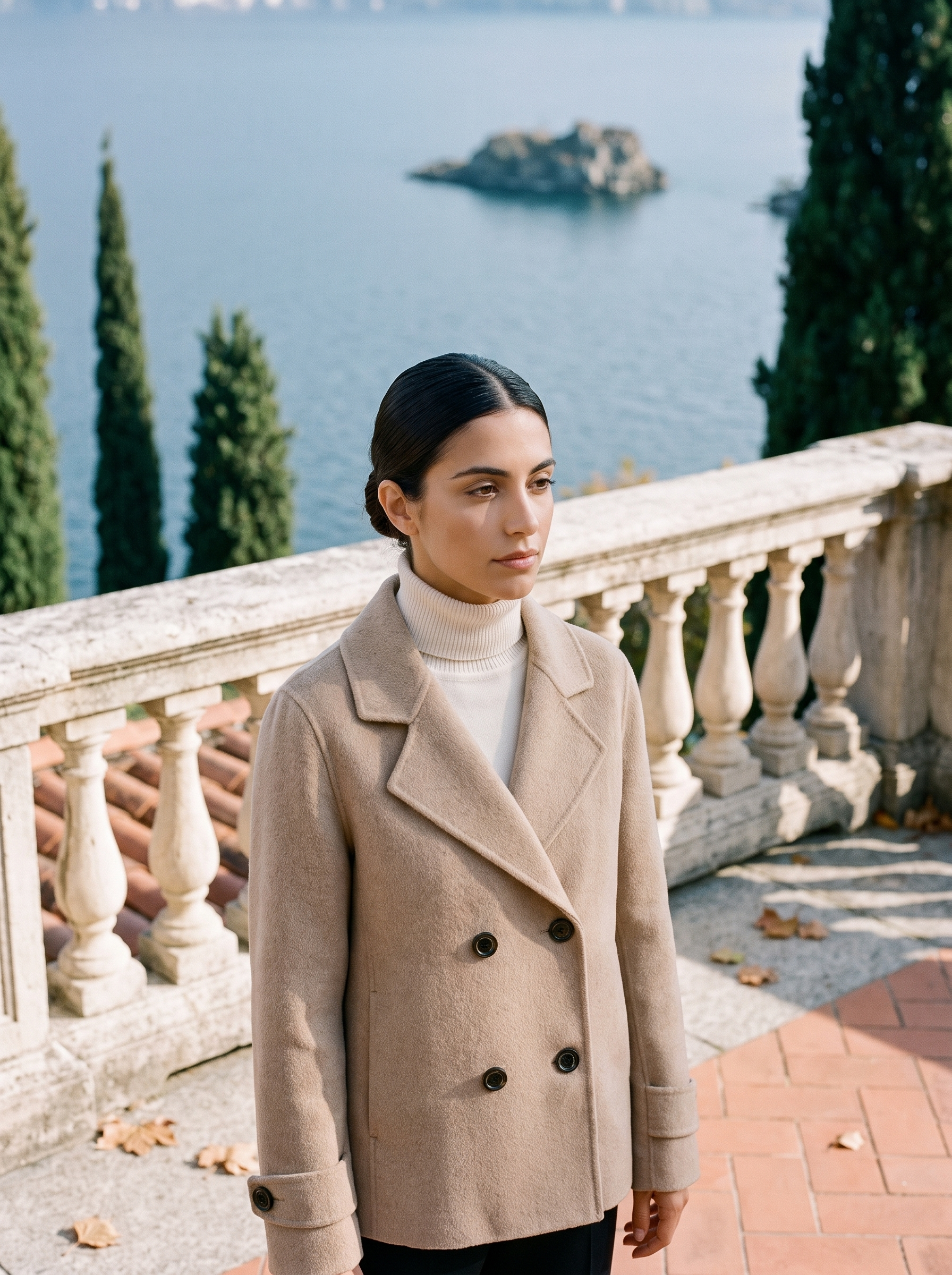 Beige ladies overcoat, double breasted, worn on a Lake Como terrace — Aveloire
