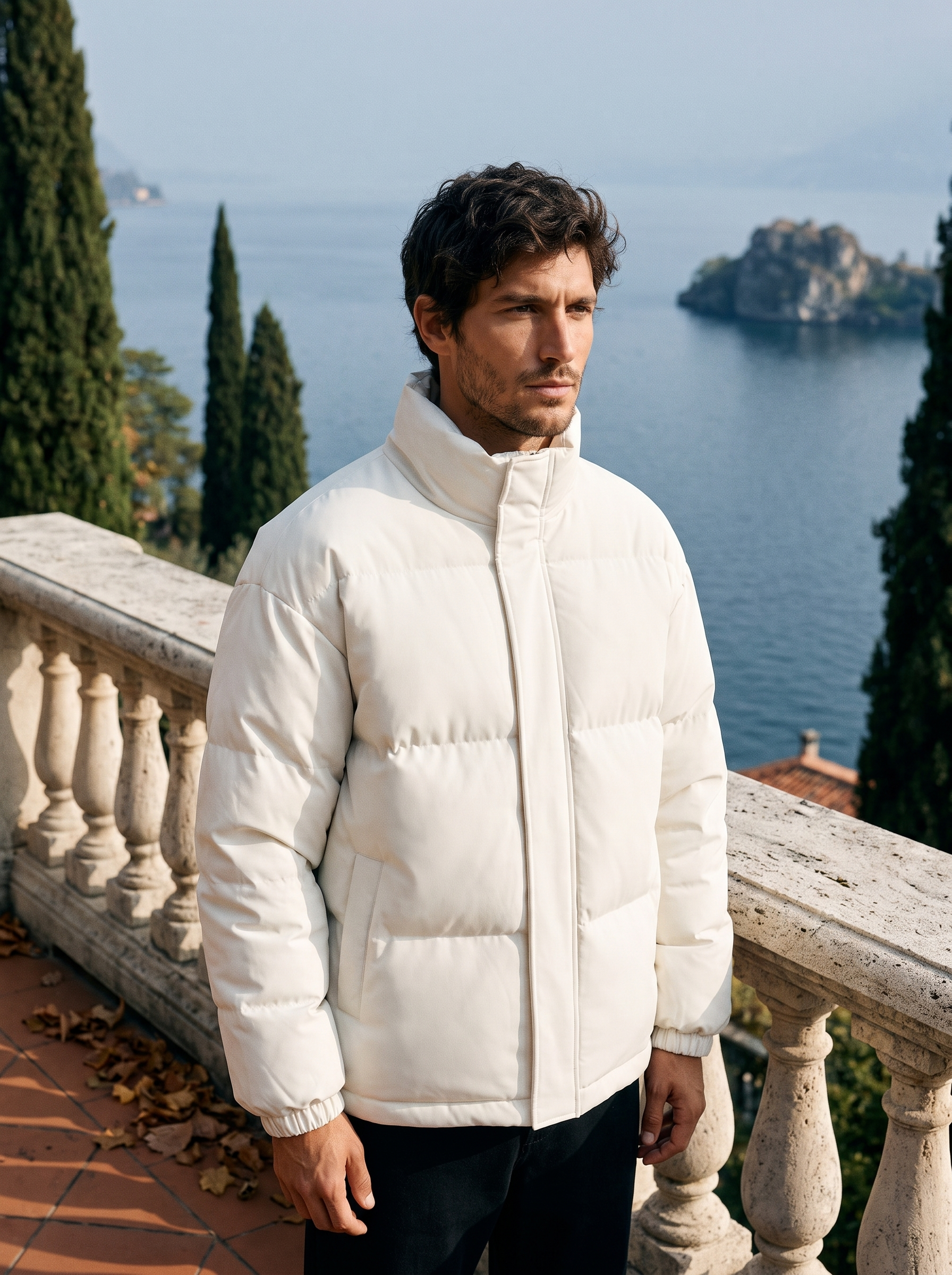 Cream puffer jacket for men, worn on a Lake Como terrace — Aveloire