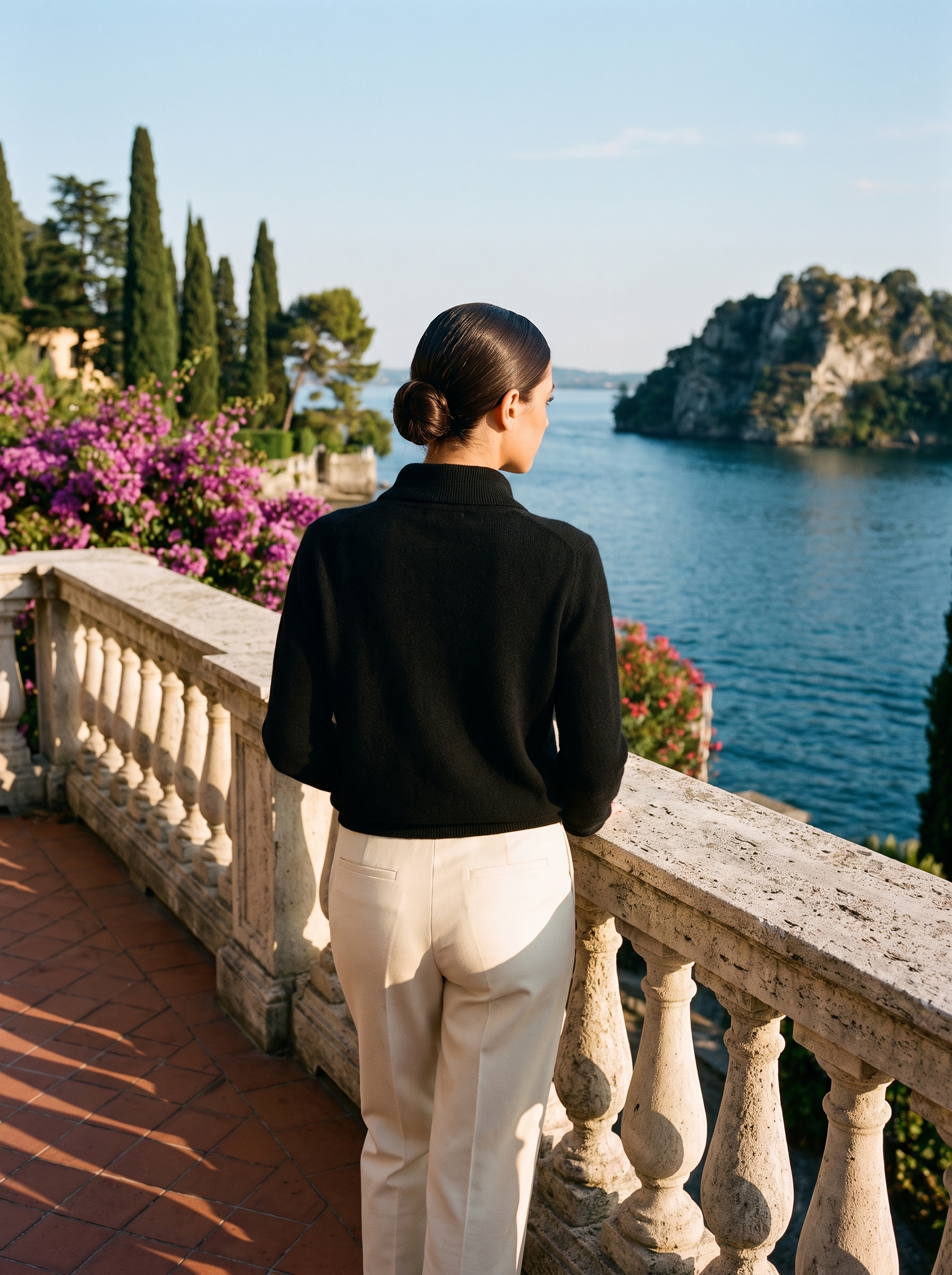 Black stand-collar cardigan, full body back view on a Lake Como terrace — Aveloire