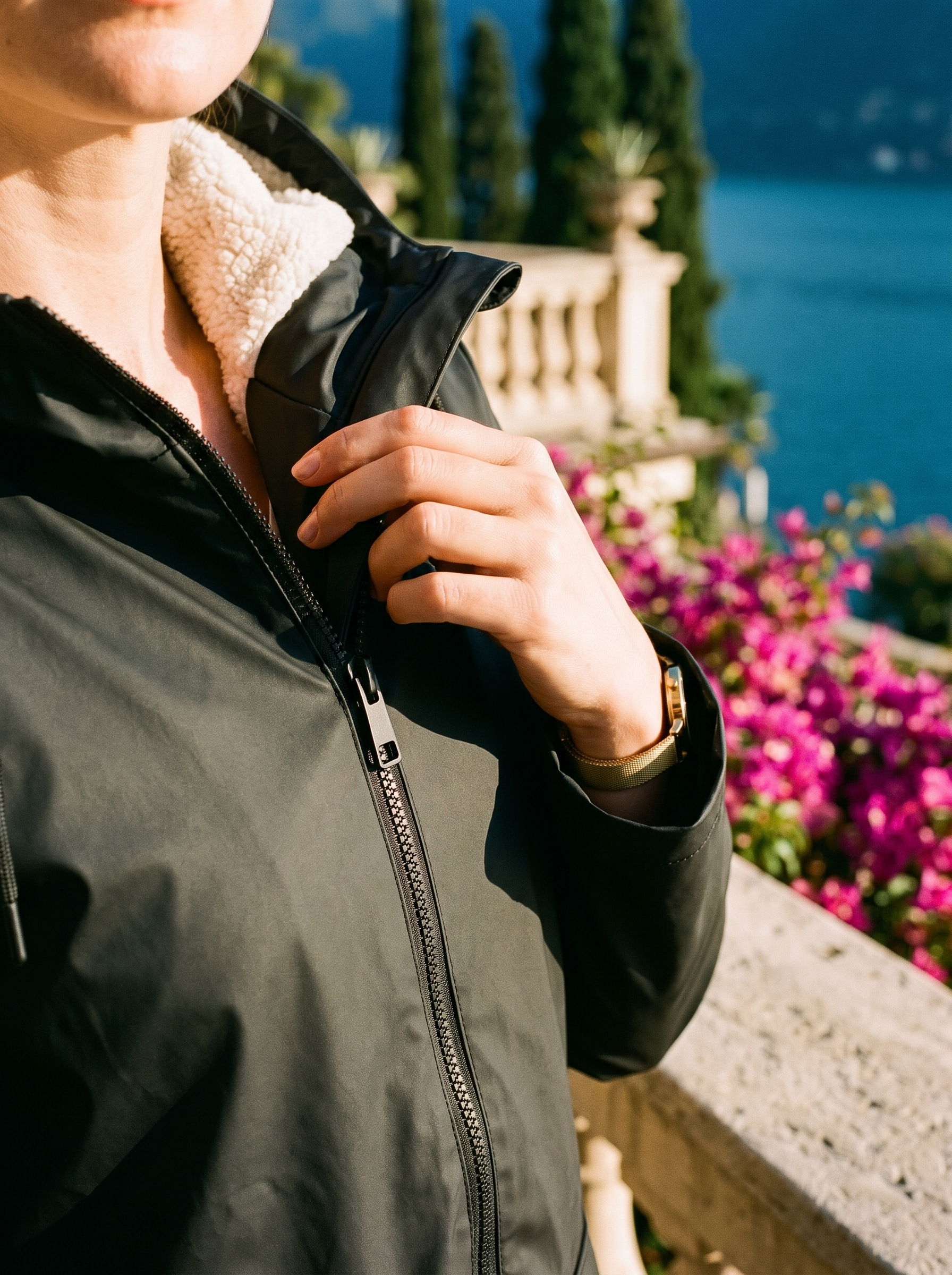 Black waterproof rain jacket hood zip detail — Aveloire