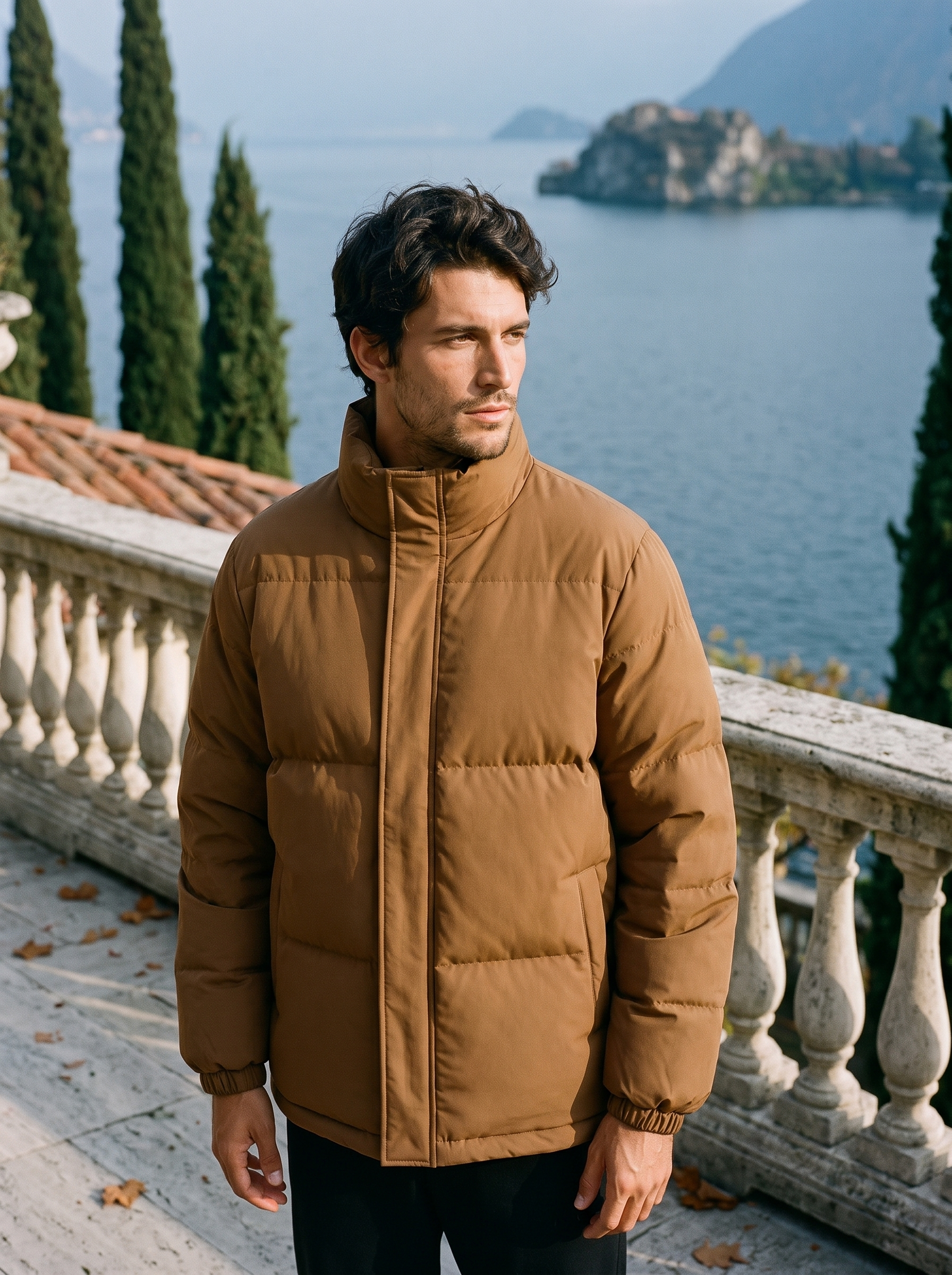 Brown puffer jacket for men, worn on a Lake Como terrace — Aveloire