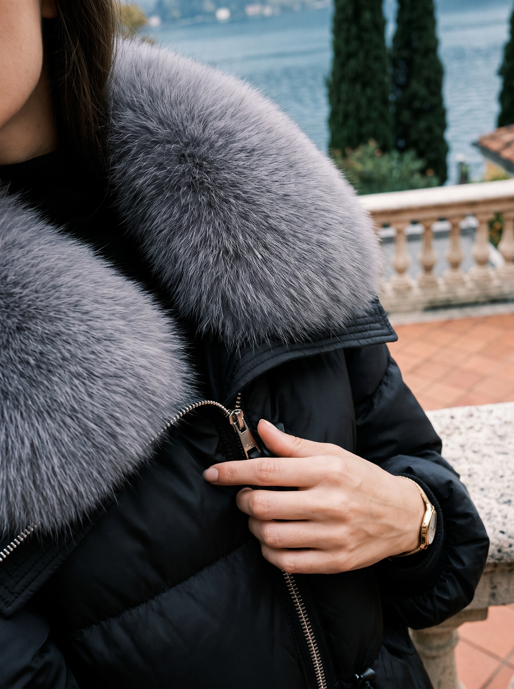 Close-up of the oversized faux fur collar on the black puffer jacket — Aveloire