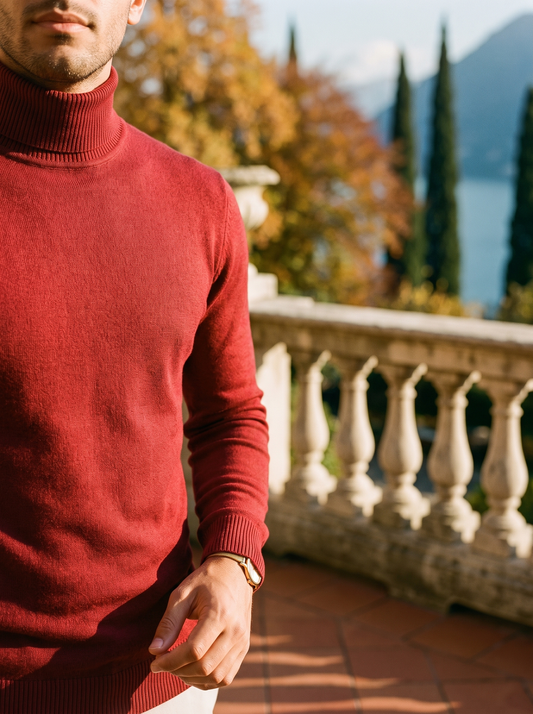 Close-up of the fine-gauge knit and ribbed roll neck collar on a red wool turtleneck sweater — Aveloire