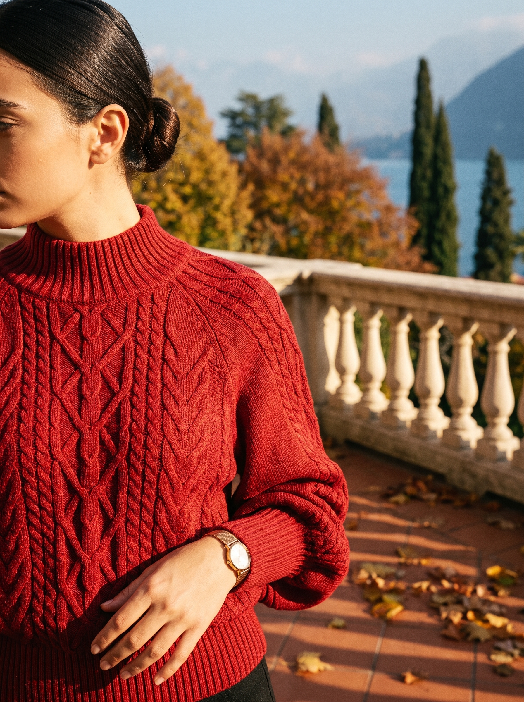Close-up of the cable knit texture and ribbed mock neck collar on a red sweater — Aveloire