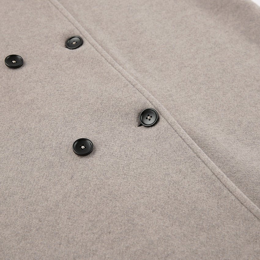 Close-up of the double breasted button placket on the oatmeal wool coat — Aveloire