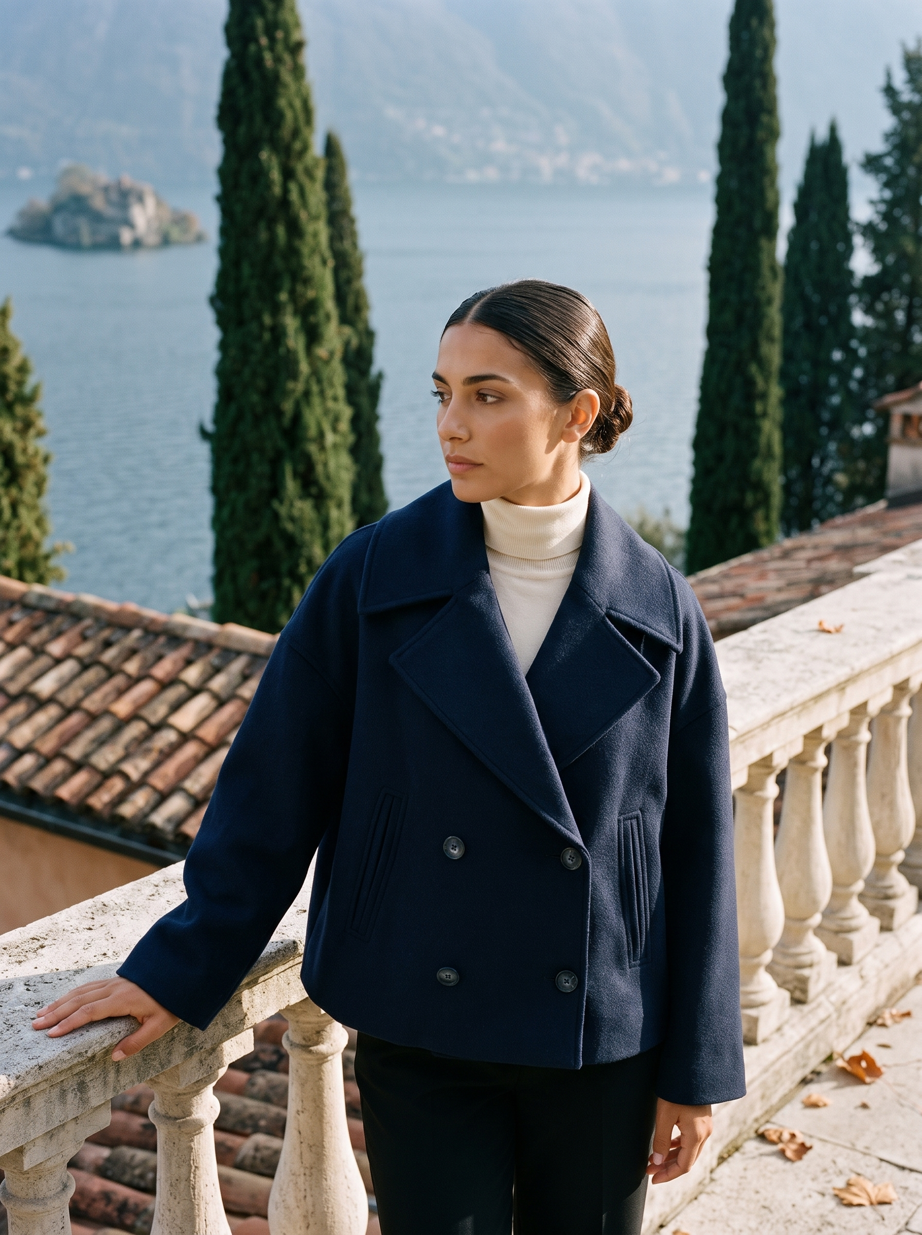 Navy cropped peacoat for women, worn on a Lake Como terrace — Aveloire