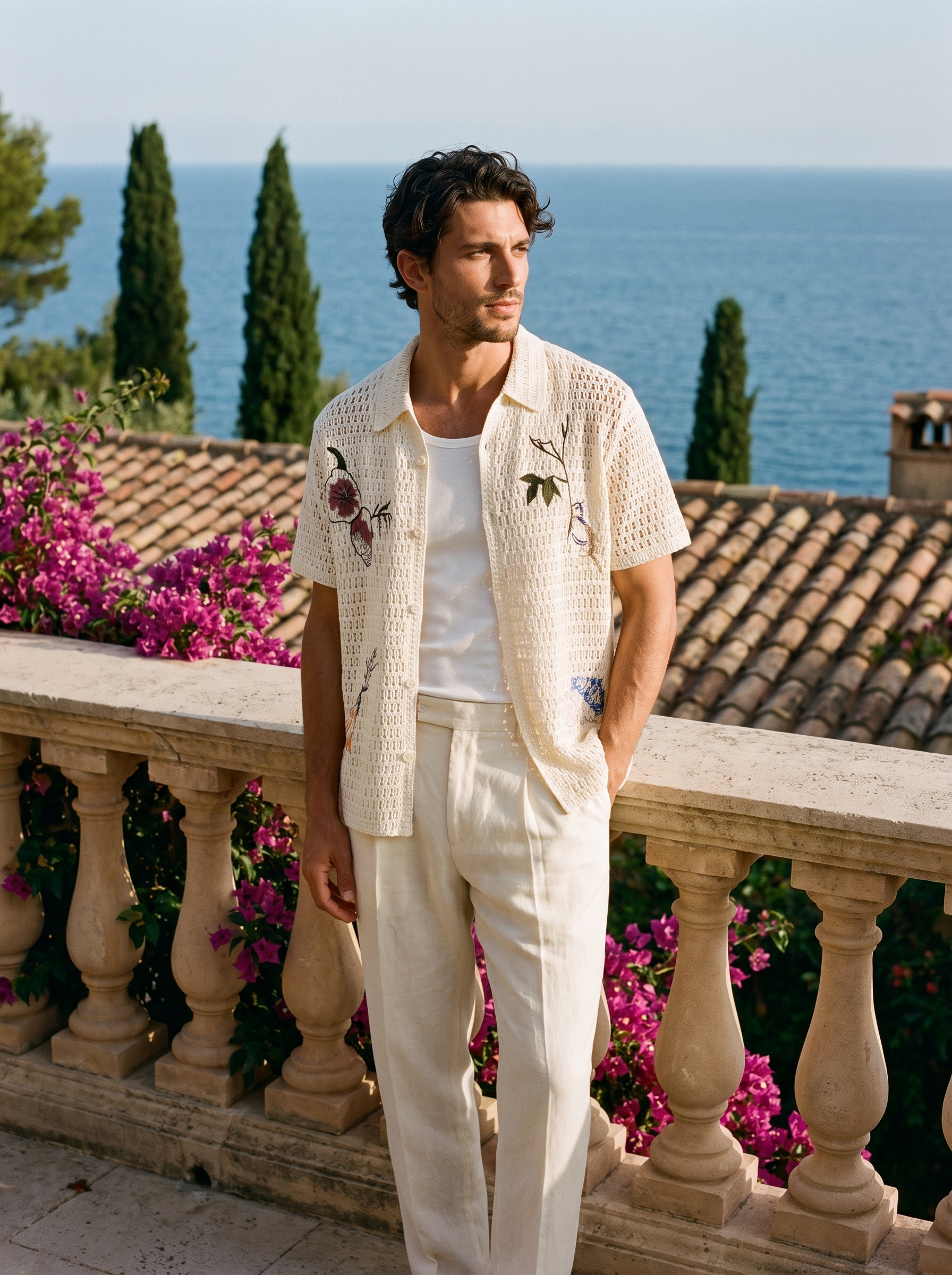 Full-length shot of a man in an ivory embroidered crochet shirt at Lake Como — Aveloire
