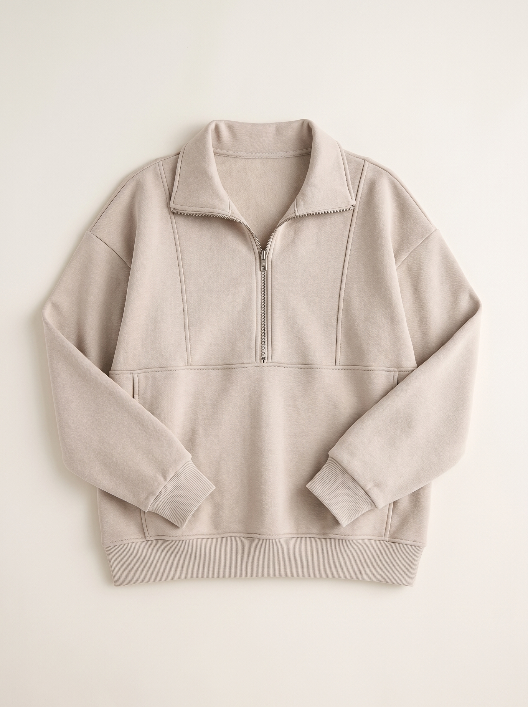 Beige oversized half-zip pocket sweatshirt flat lay product photo — Aveloire
