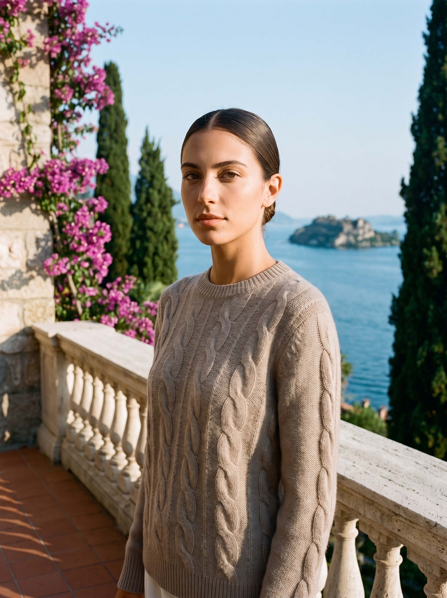 Woman wearing a warm beige cable-knit crew neck sweater on a Lake Como terrace — Aveloire