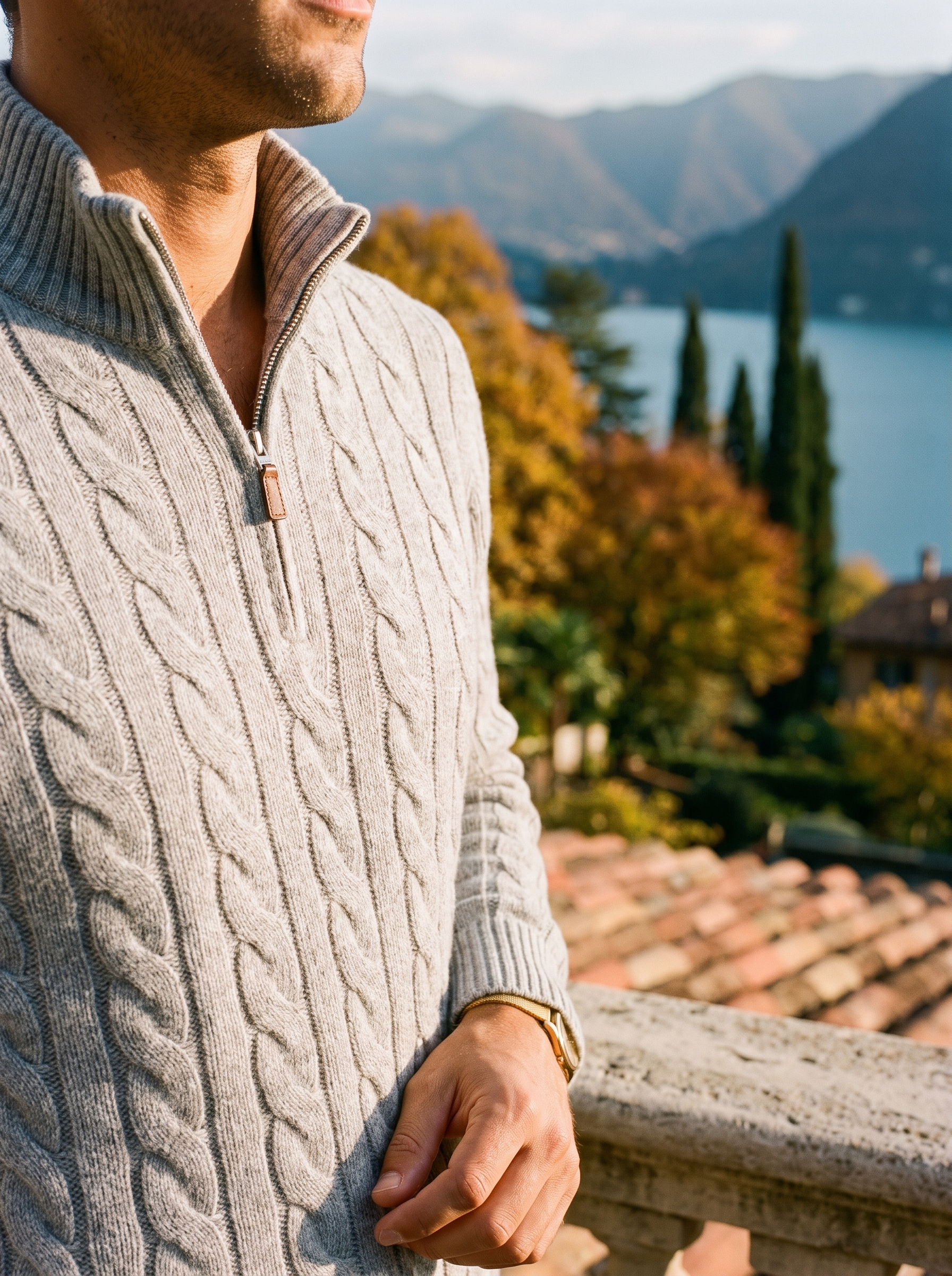 Close-up of the cable knit texture on a light gray wool quarter zip sweater — Aveloire